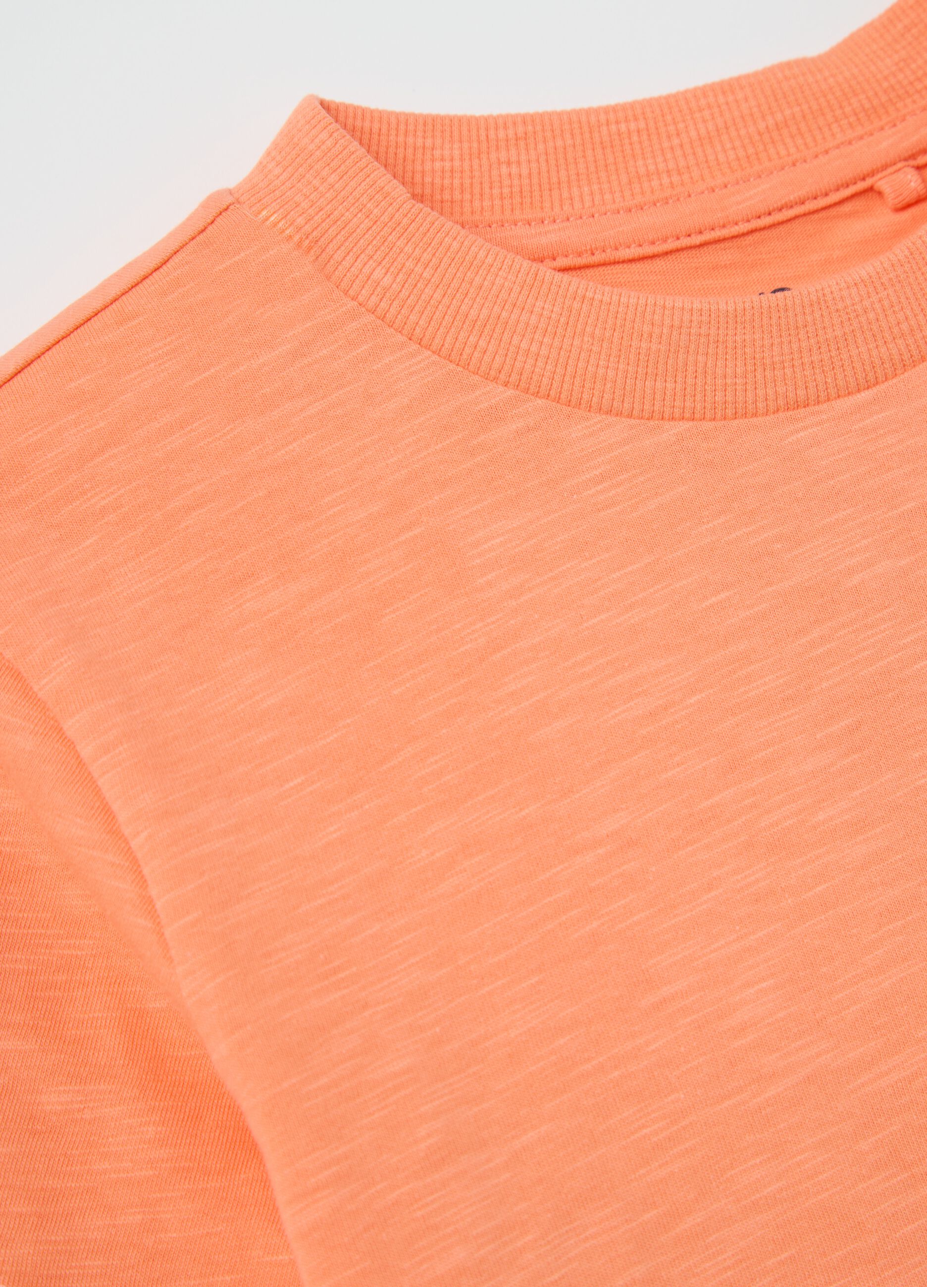 Orange T-shirt in organic cotton with pocket