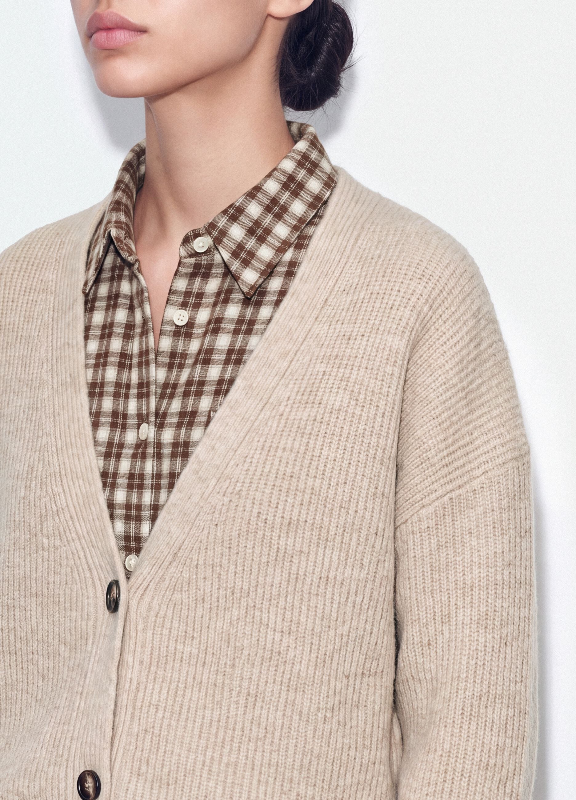 Beige stretch-fabric cardigan with deep V-neck