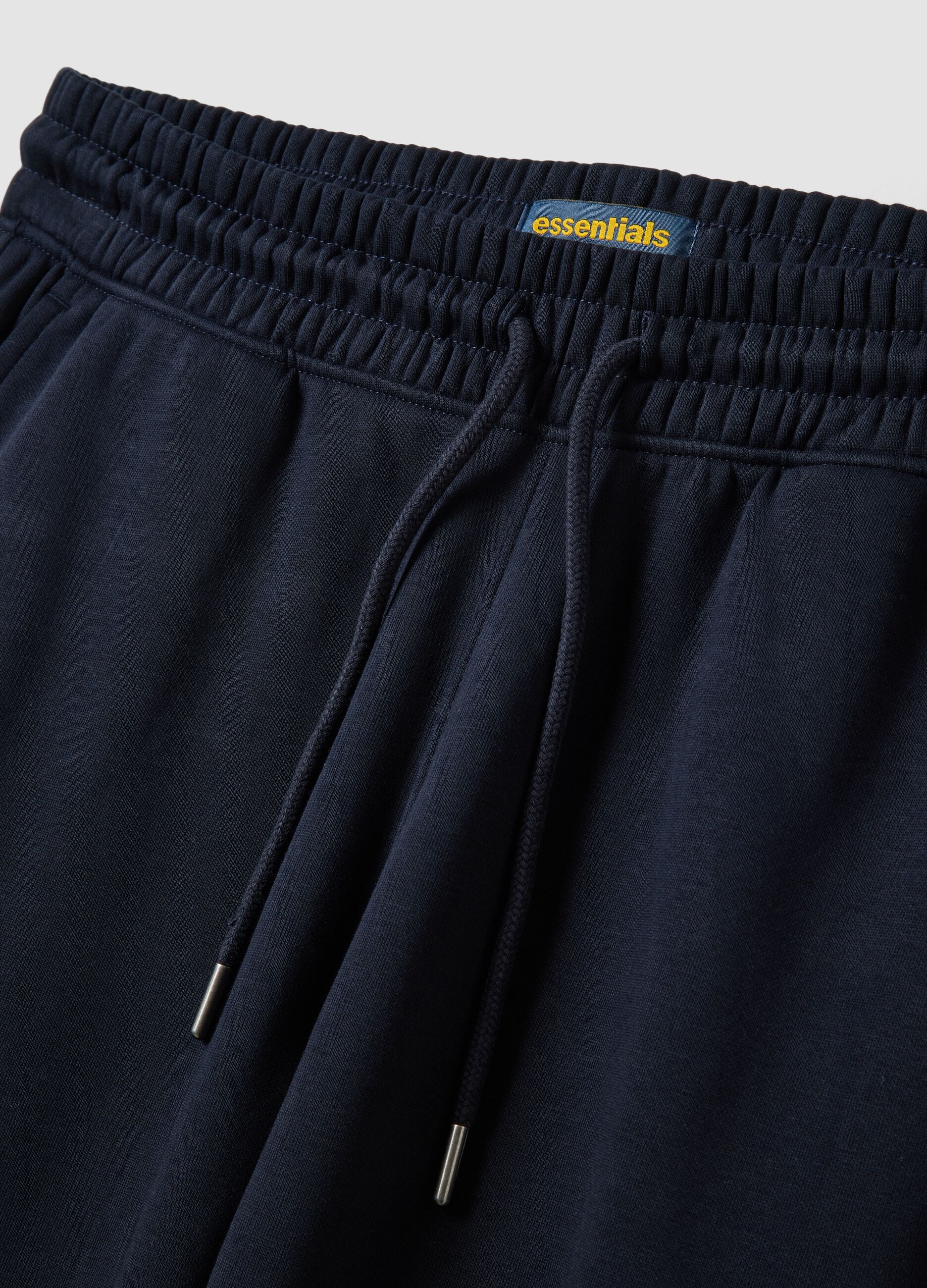 Blue cotton-blend joggers with cuffed hem and drawstring