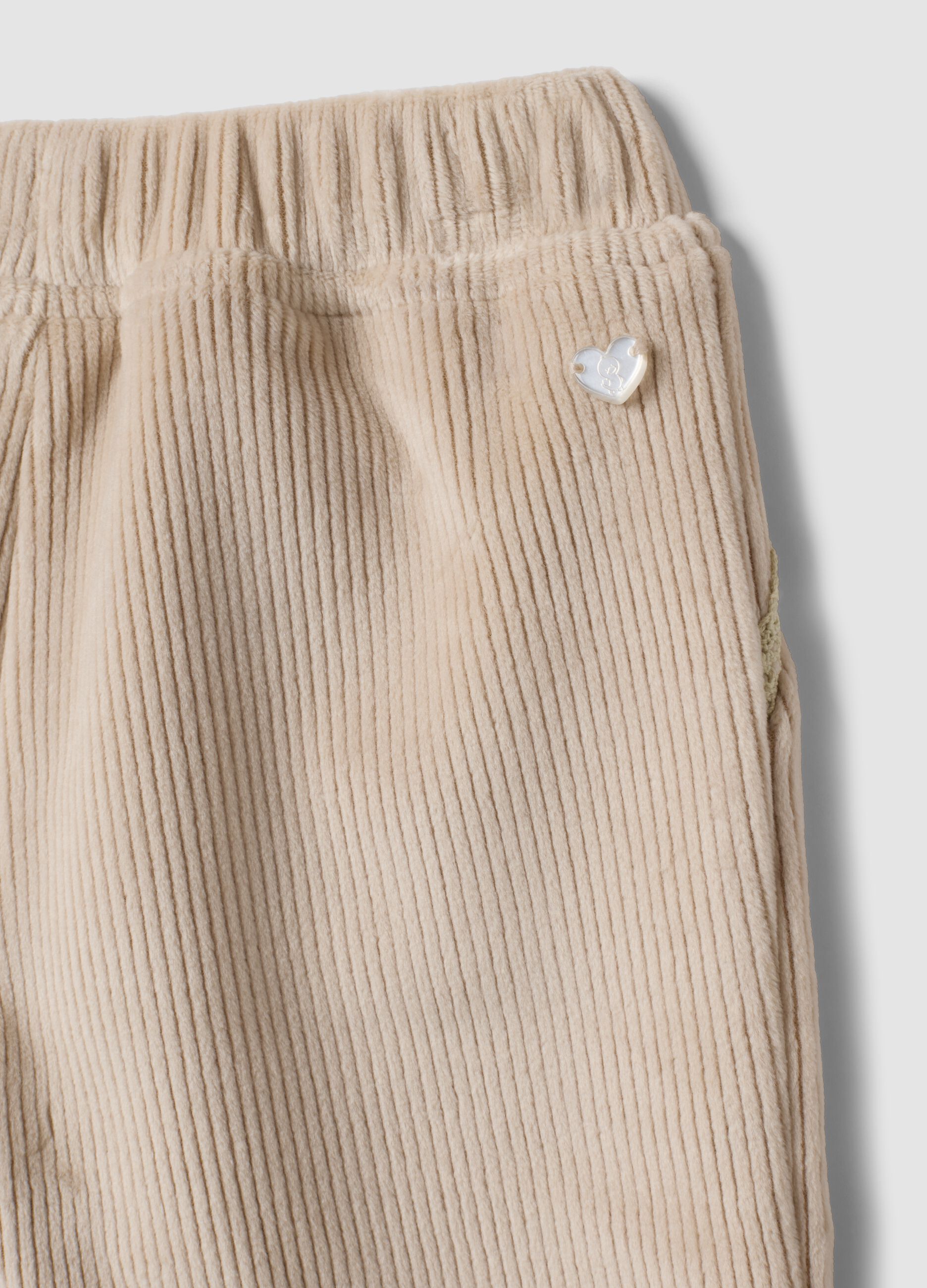 Pantaloni beige in tessuto elasticizzato a coste per neonata