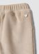 Pantaloni beige in tessuto elasticizzato a coste per neonata_3