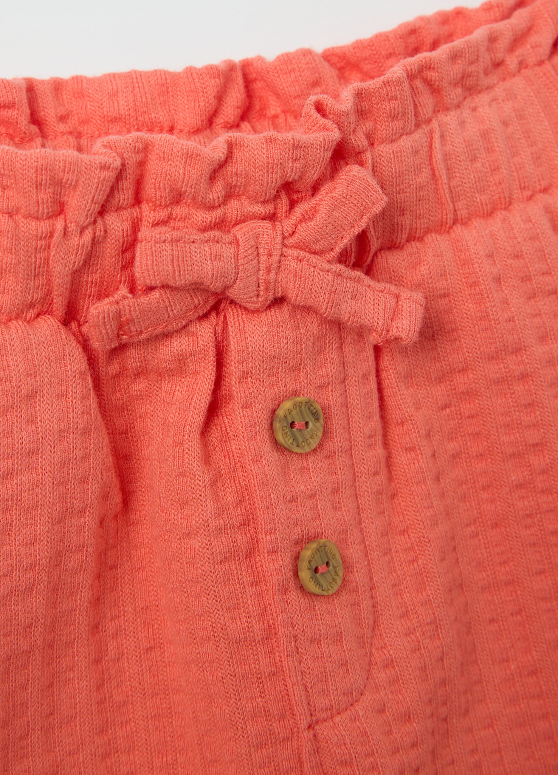 Girls’ shorts in 100% orange cotton with regular fit