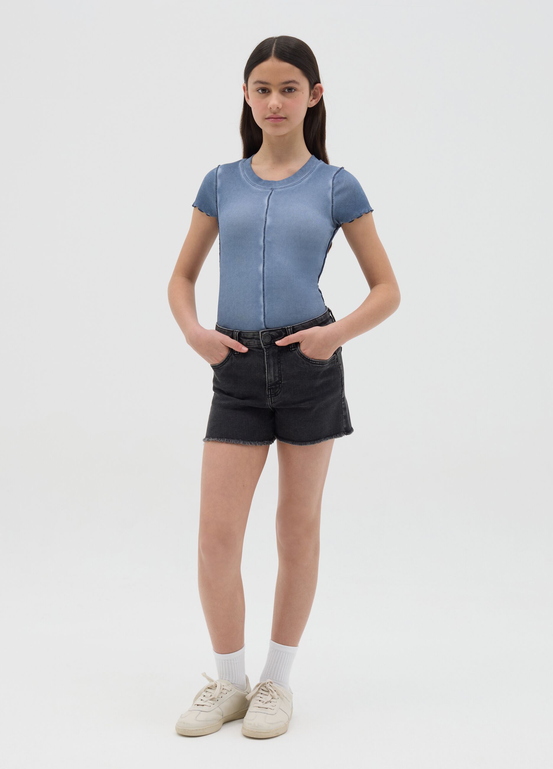 Black shorts with five pockets and fringed hem