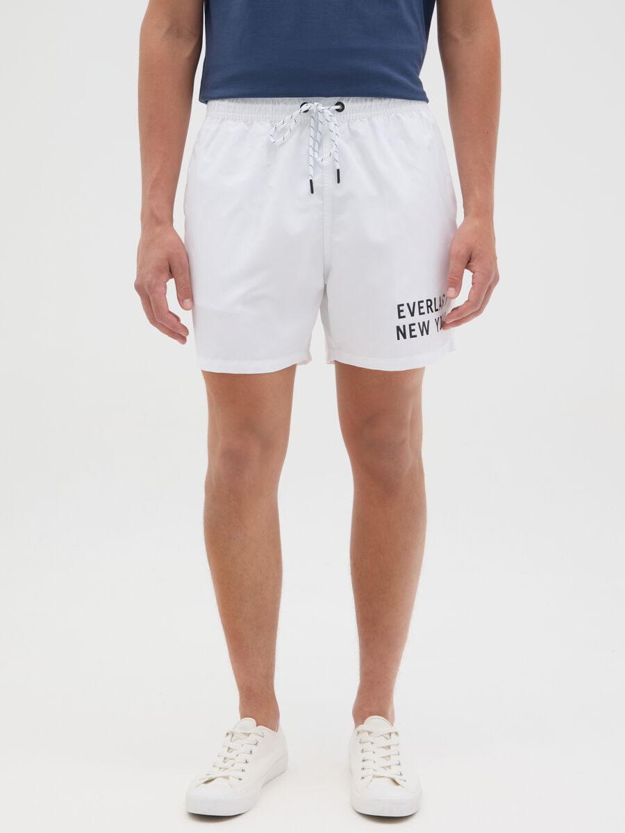 White swimming trunks with logo print_1