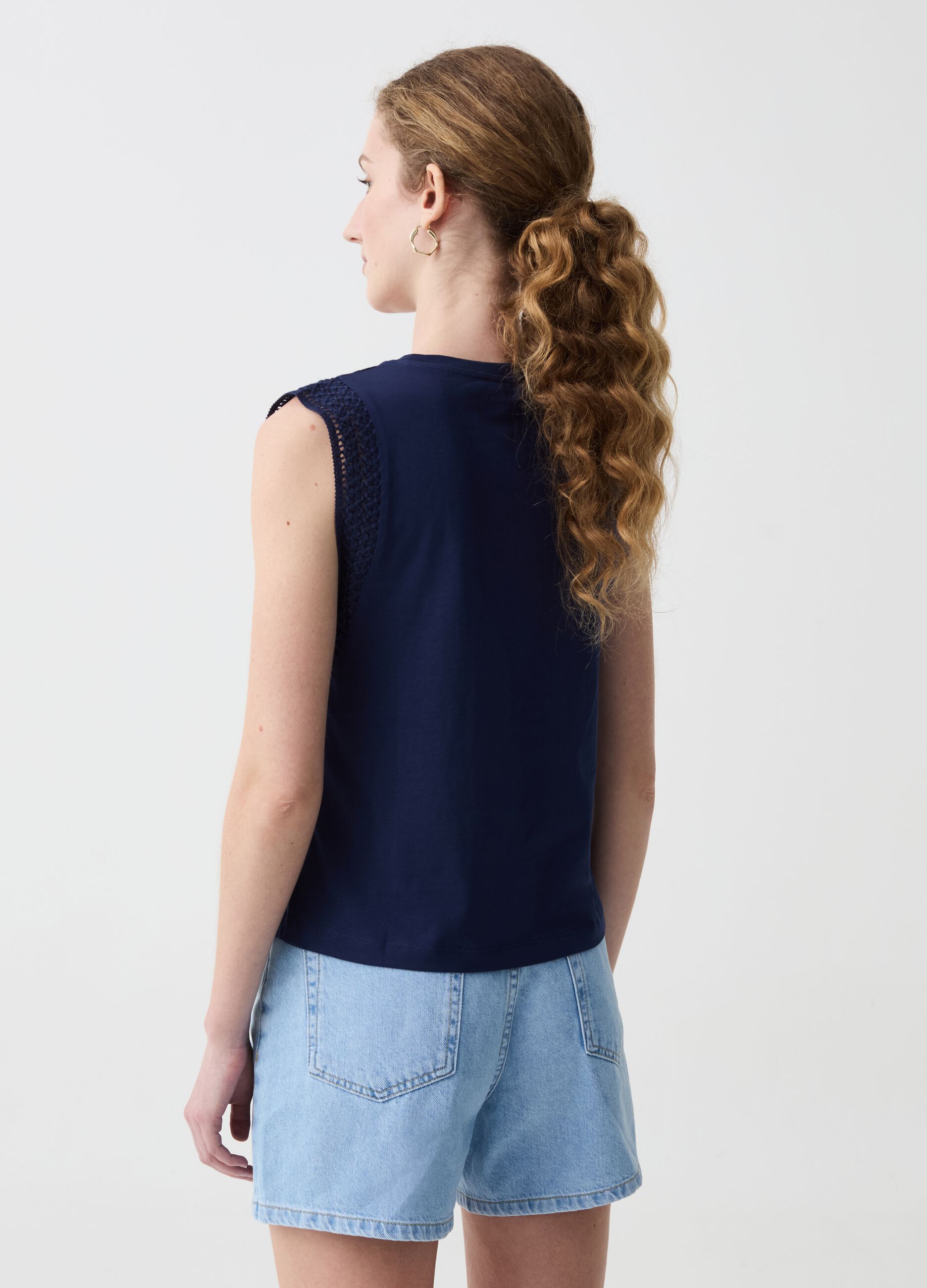 Sleeveless top with embroidered trims