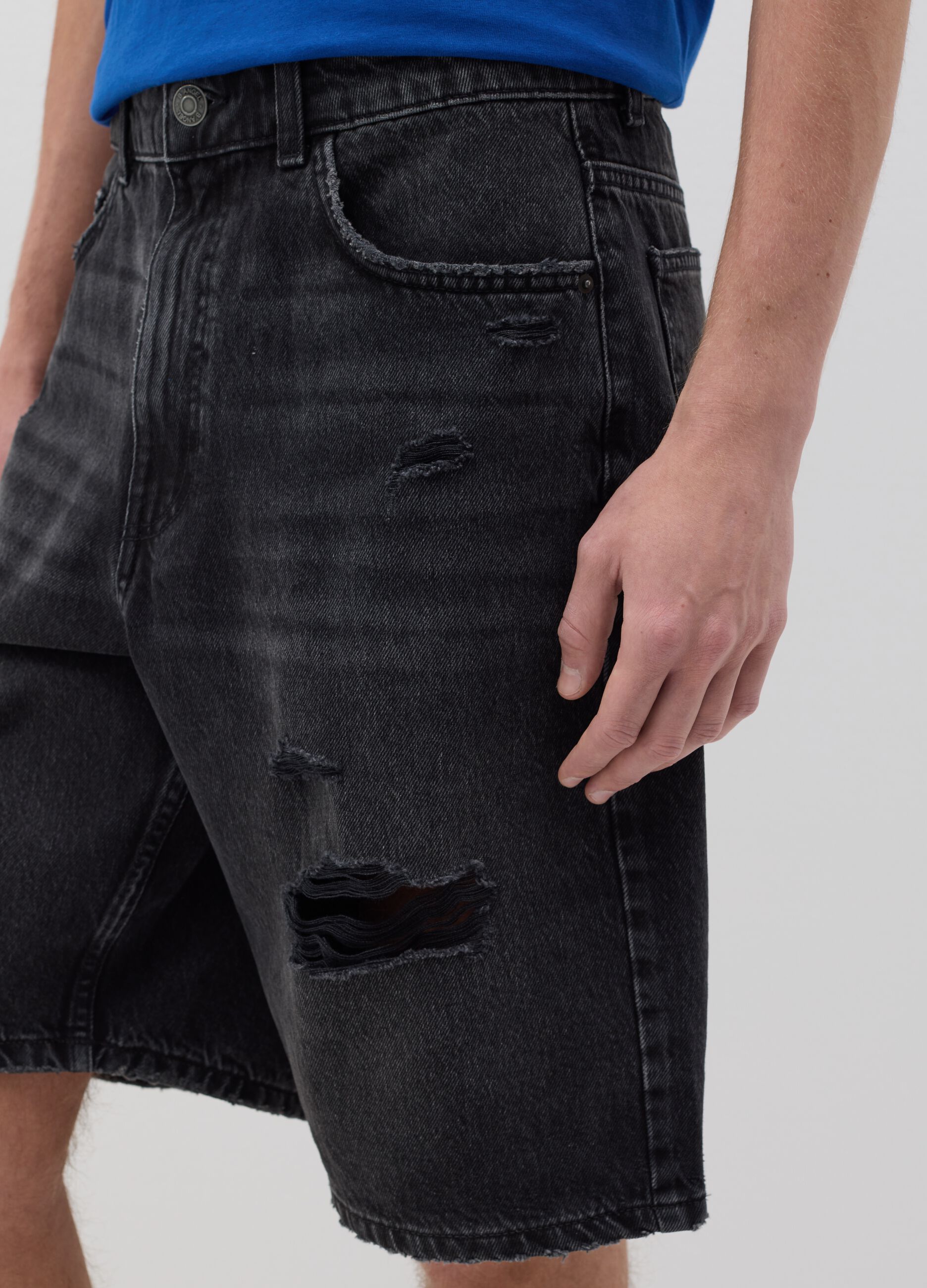 Black denim shorts with ripped details