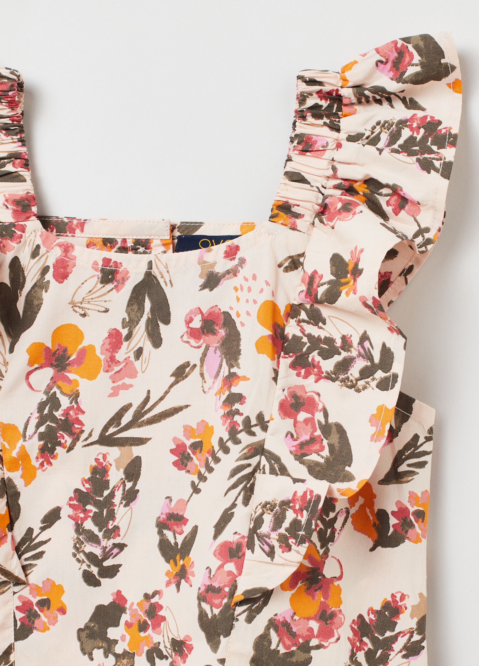 Tank top floreale in cotone con volant_1