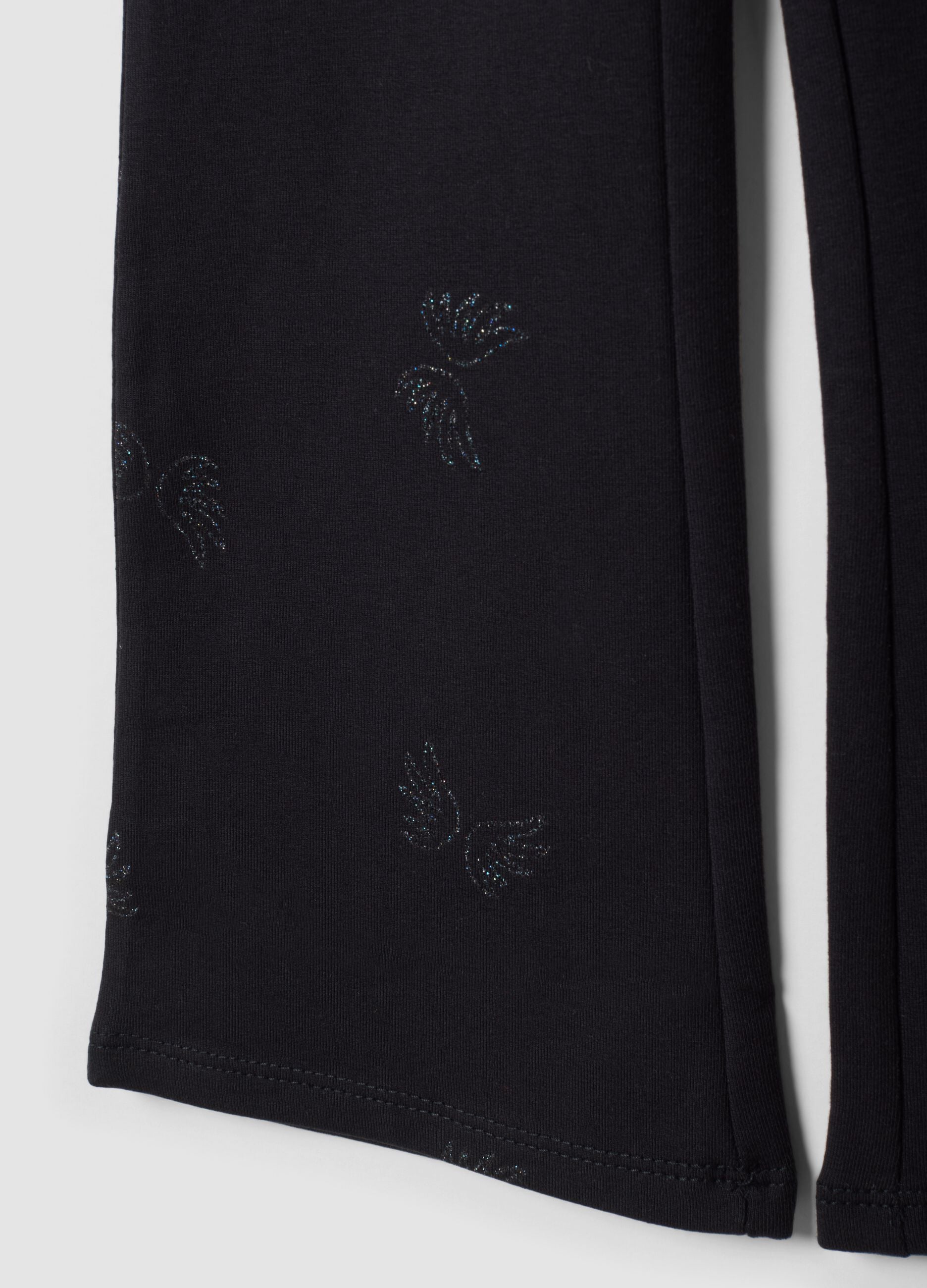 Treggings flare neri in cotone organico elasticizzato con ali glitterate