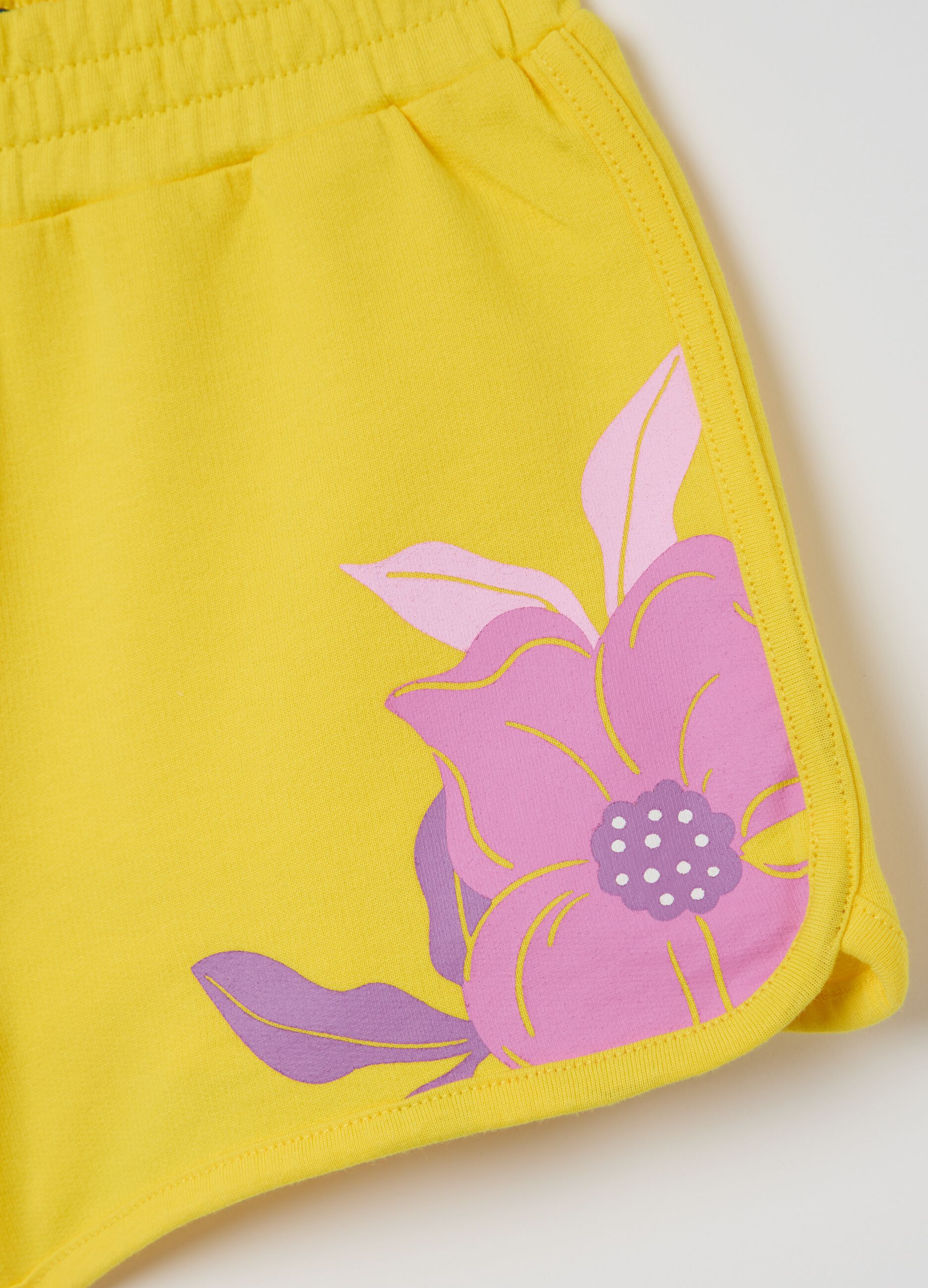 Yellow French terry shorts with print