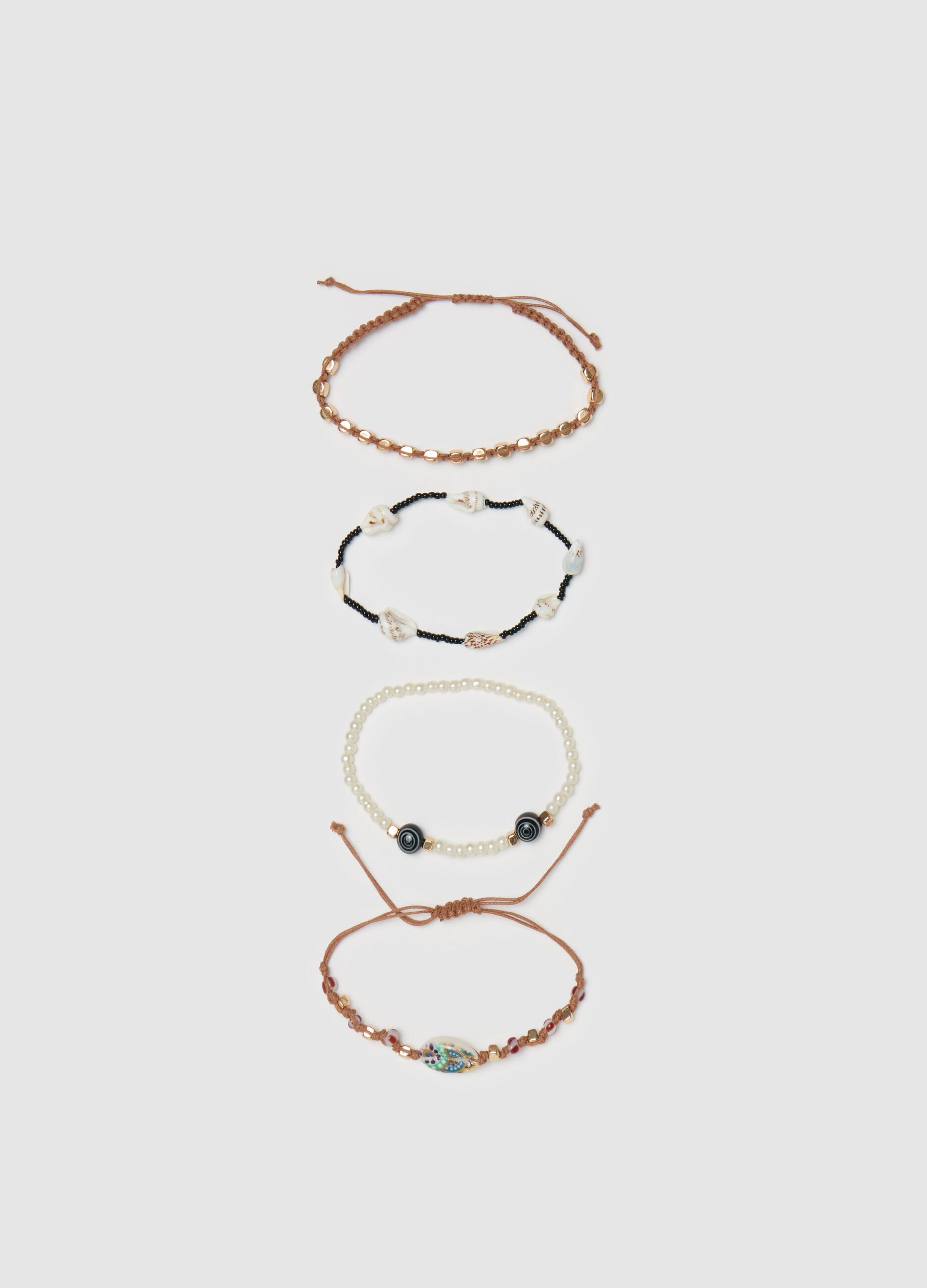 Set quattro bracciali perline e conchiglie