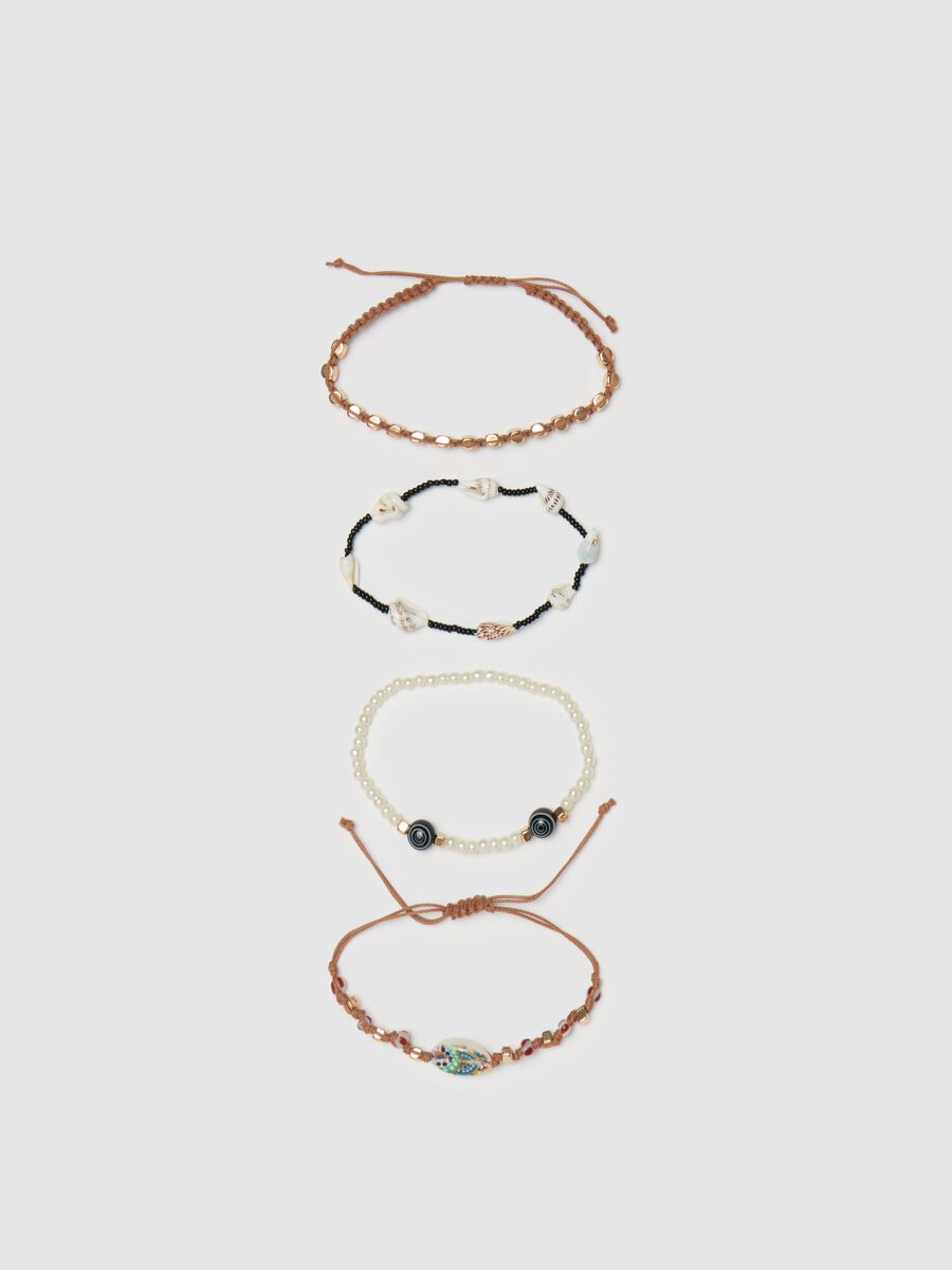 Set of four bracelets with beads and shells_0