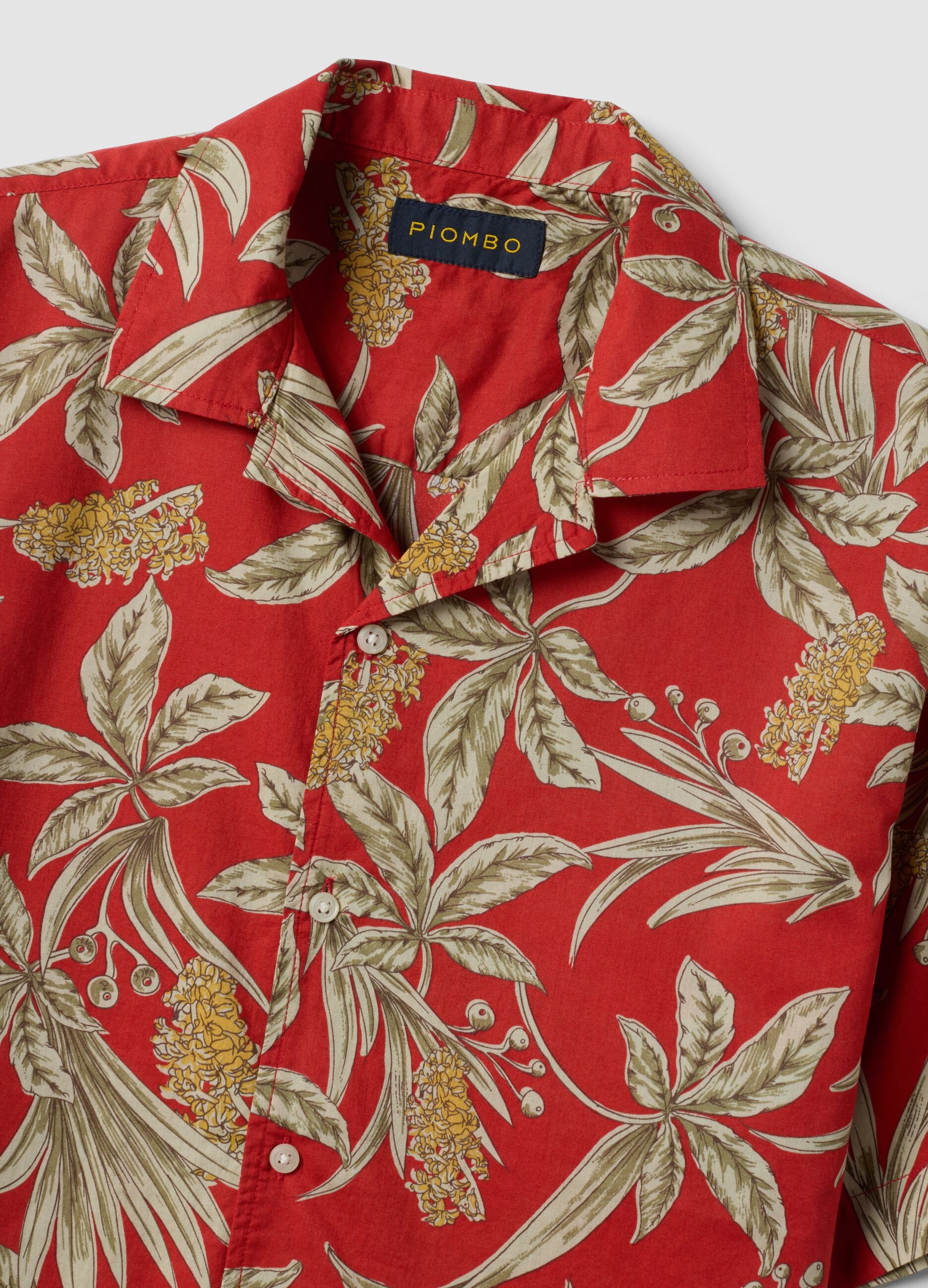 Red organic cotton shirt with tropical print