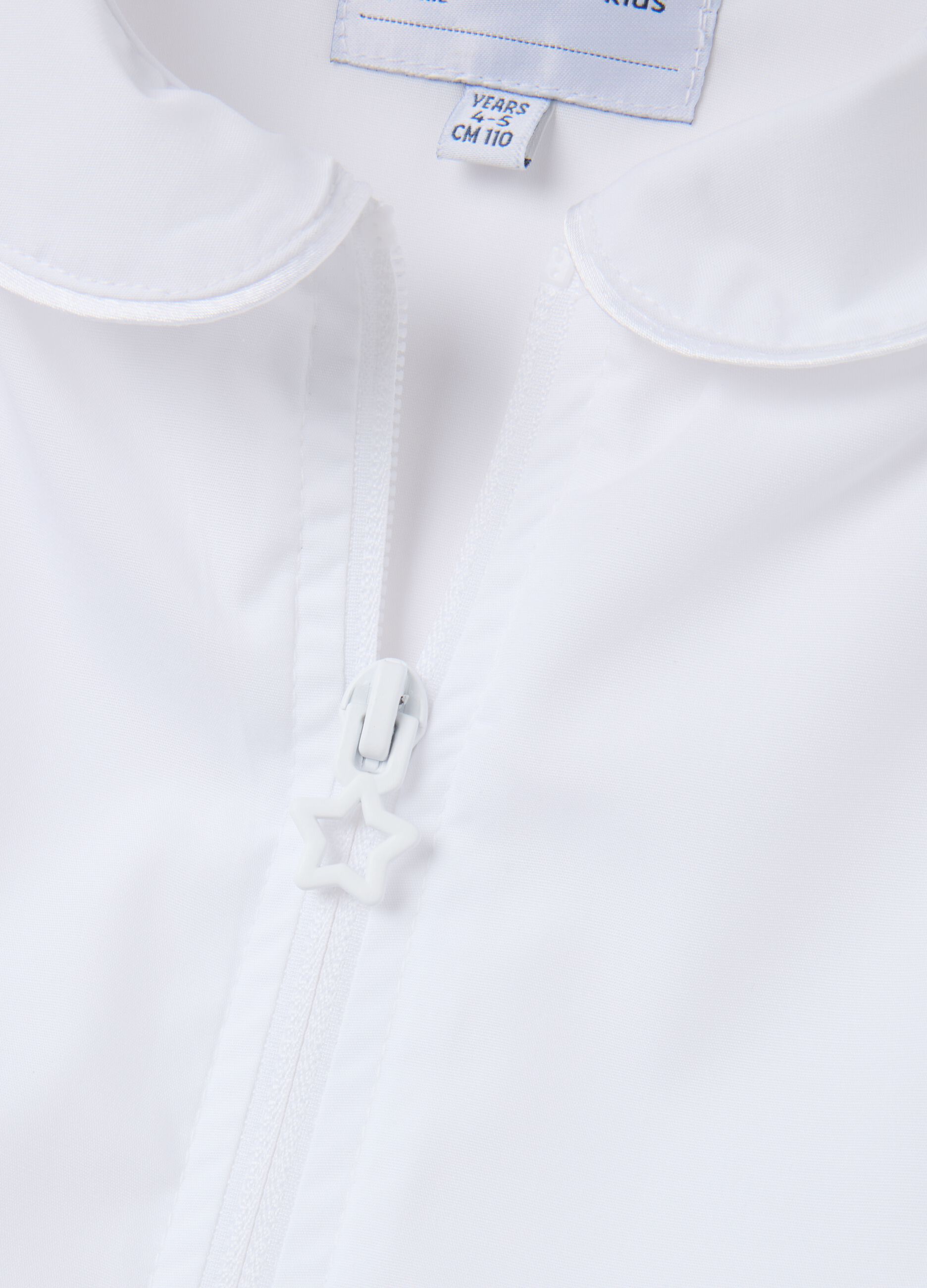 Girls' school smock in white cotton blend with unicorn