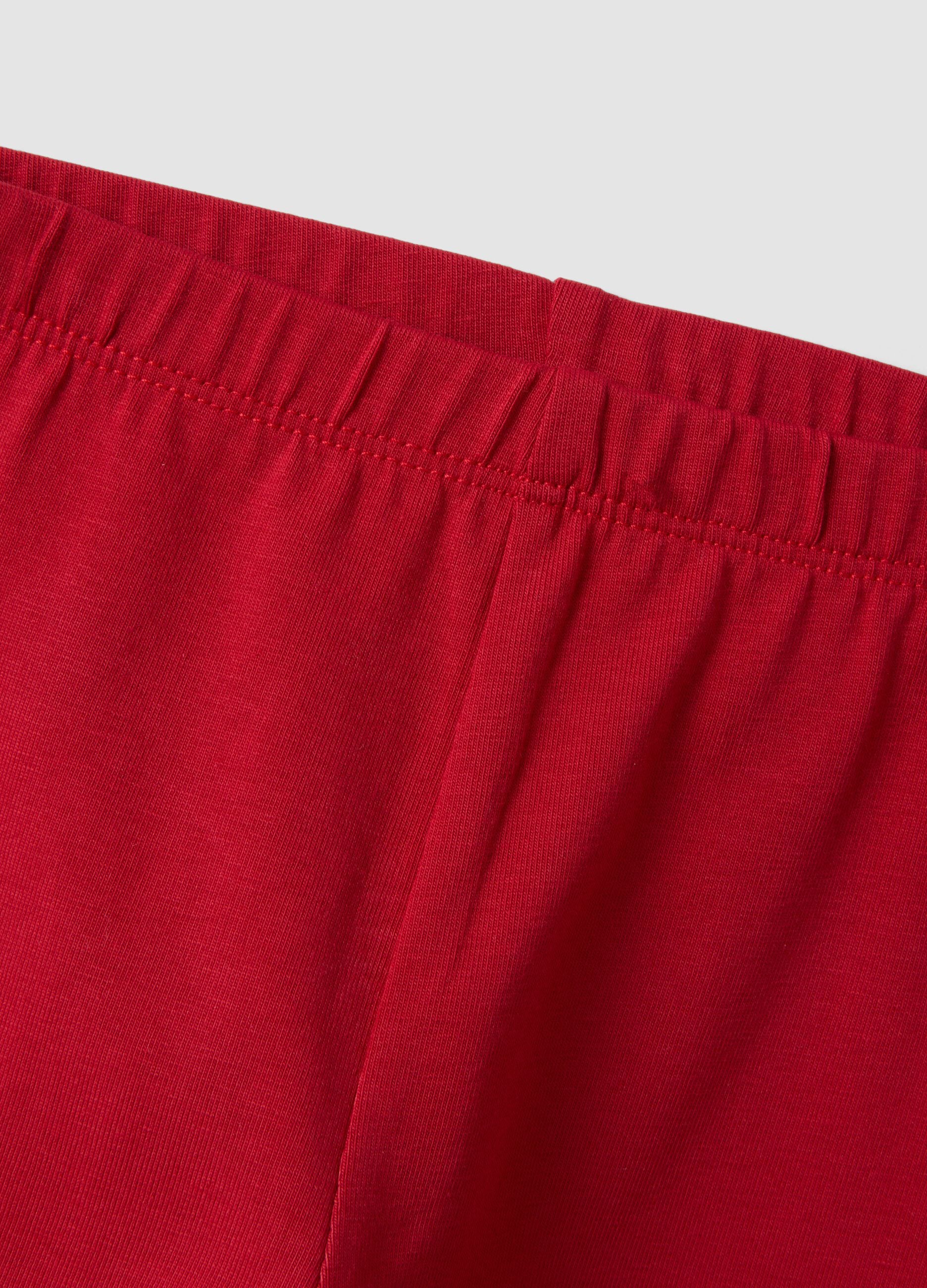 Red stretch organic cotton leggings with bow details for baby girl