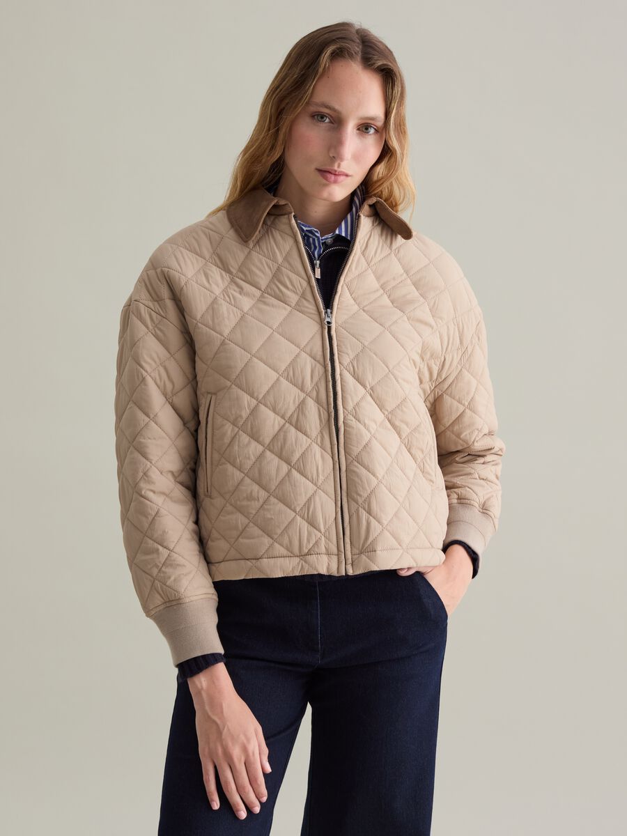 Short quilted jacket with collar in corduroy_0