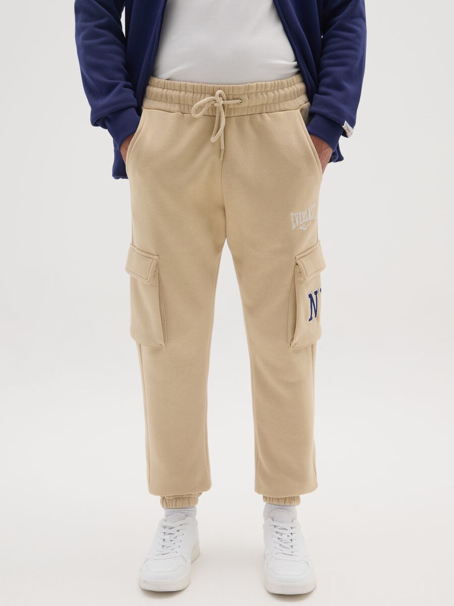 Pantaloni jogger in misto cotone beige con tasche_1