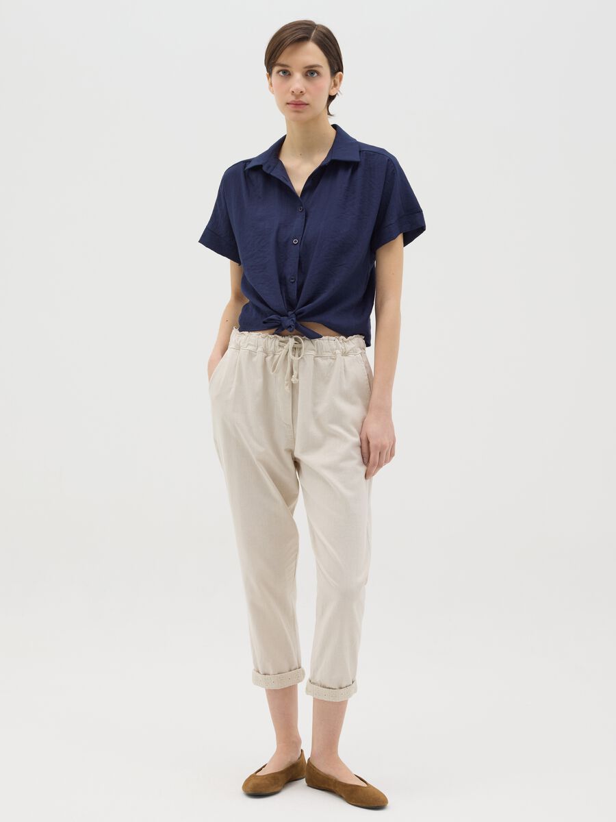 Beige trousers with drawstring and broderie anglaise details_0