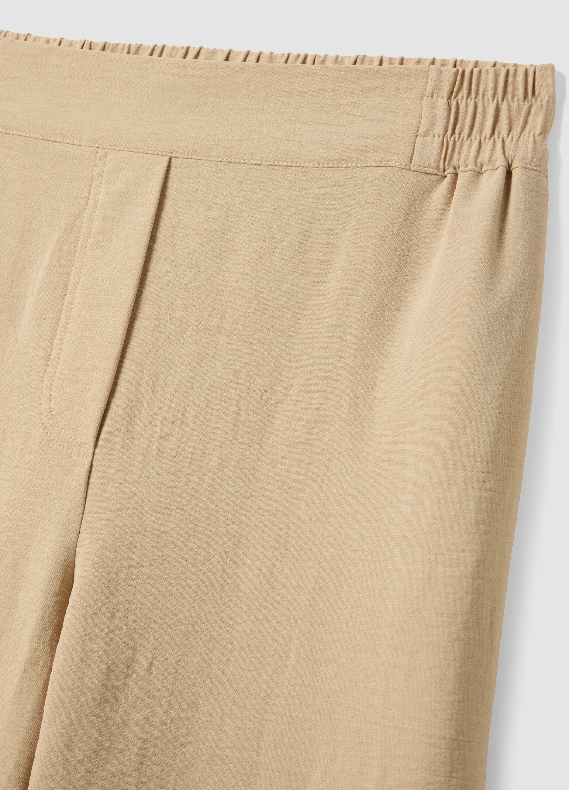 Beige wide-leg trousers with elasticated waist