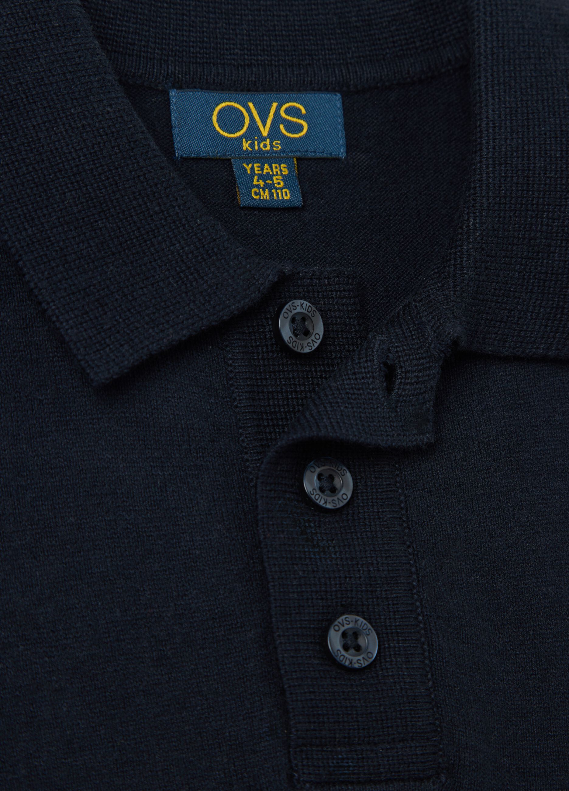 Blue polo shirt with short sleeves