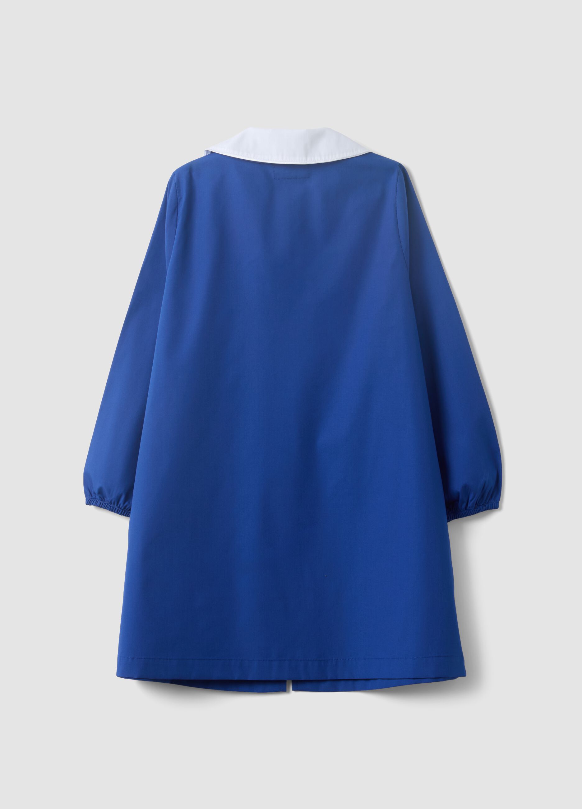 Blue girls&rsquo; school apron with rainbow embroidery