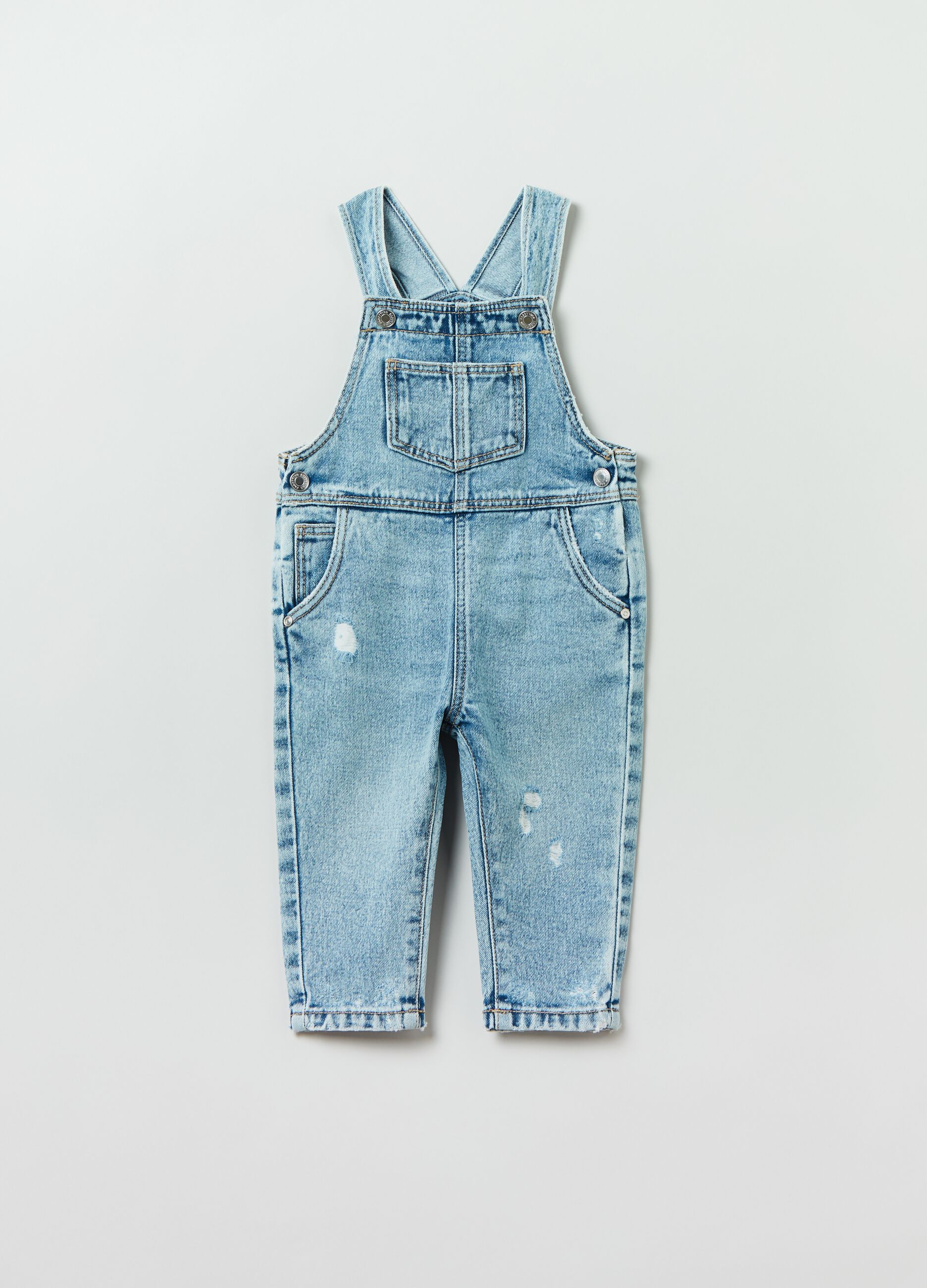 Salopette in denim con abrasioni_0