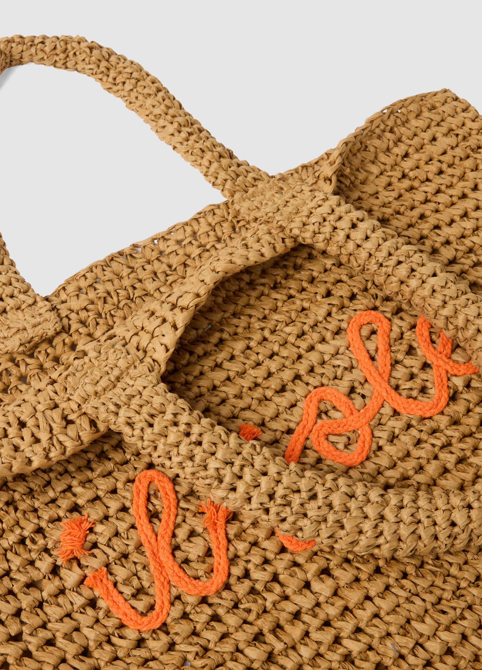 Brown beach bag in paper fabric