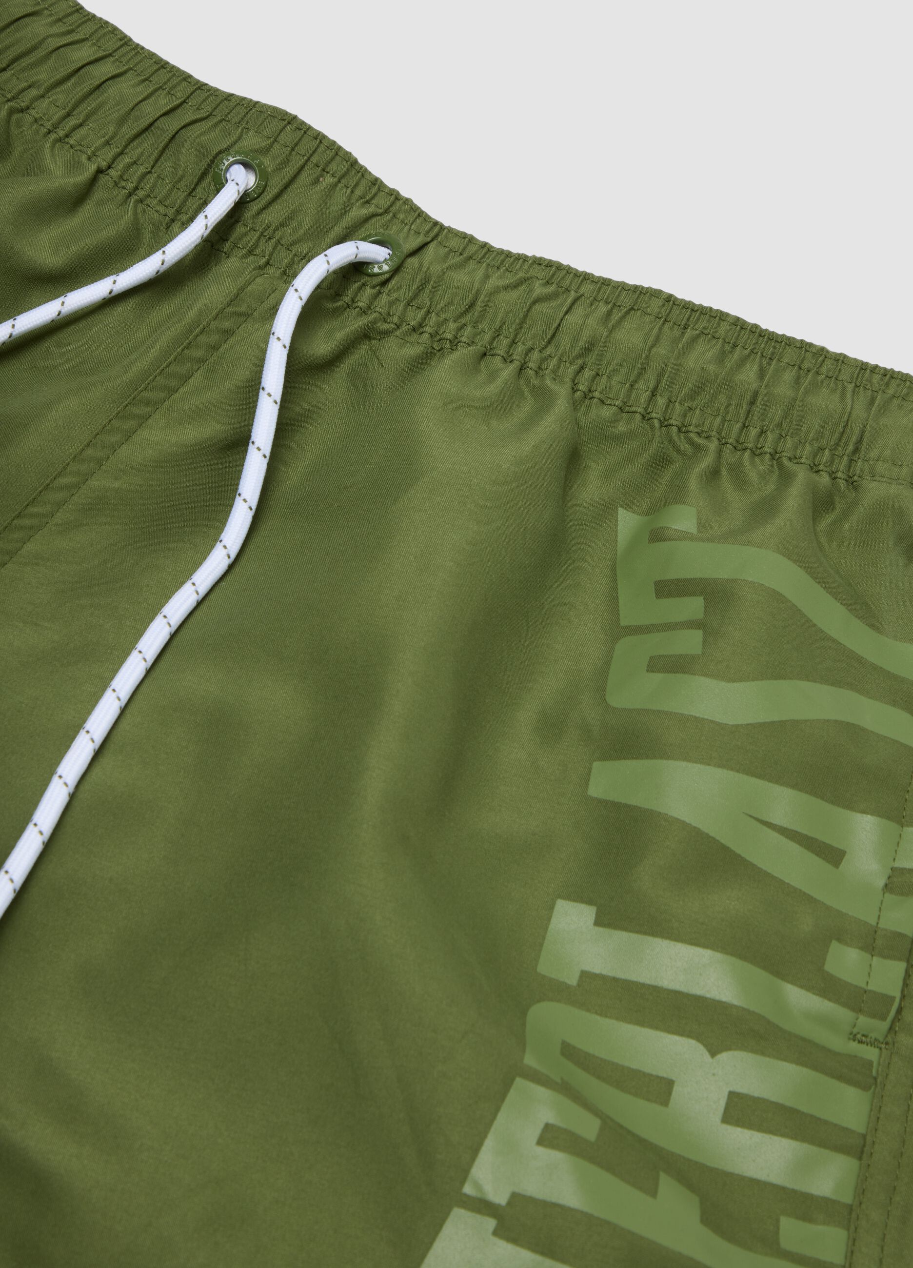 Green swim shorts with contrast drawstring