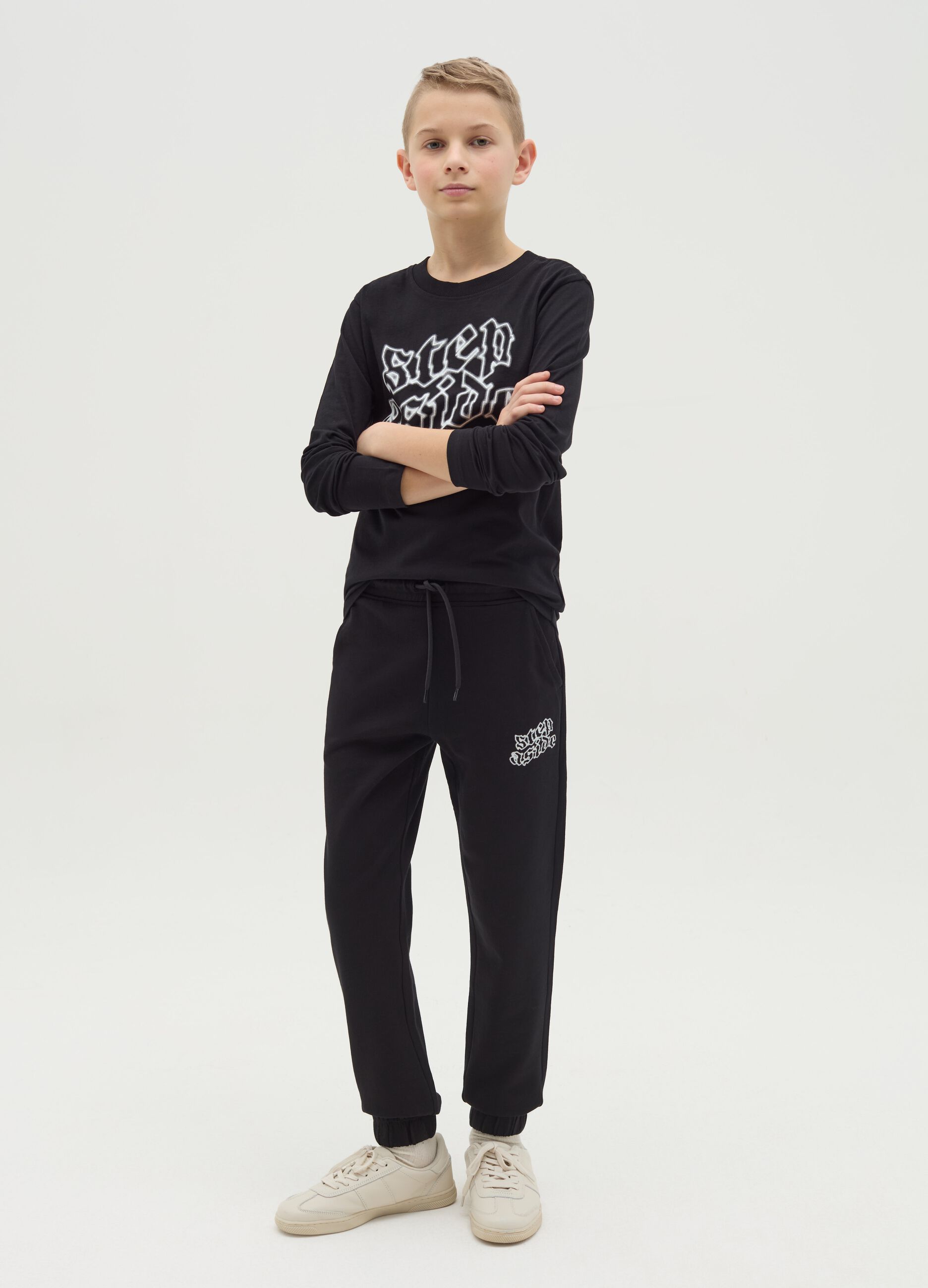 Joggers with drawstring and "Step Aside" print
