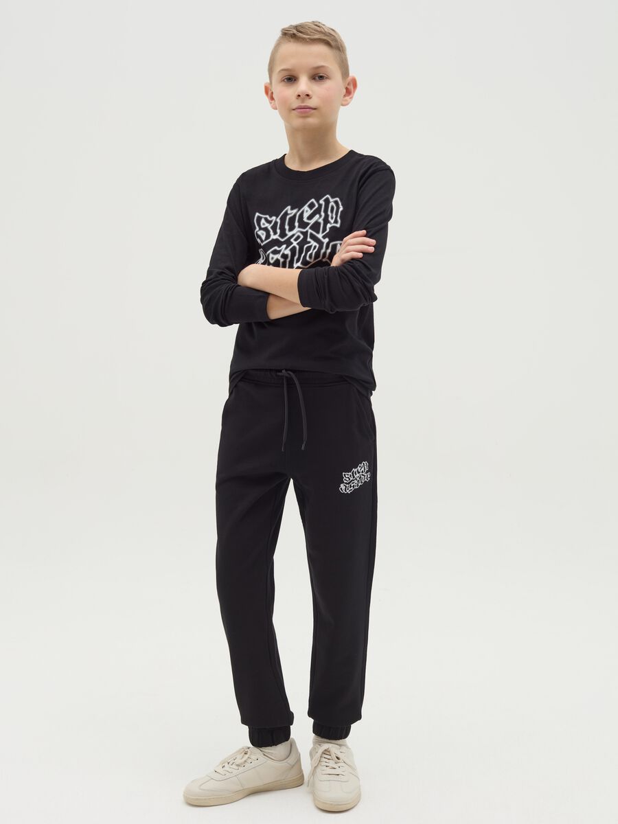 Joggers with drawstring and "Step Aside" print_1