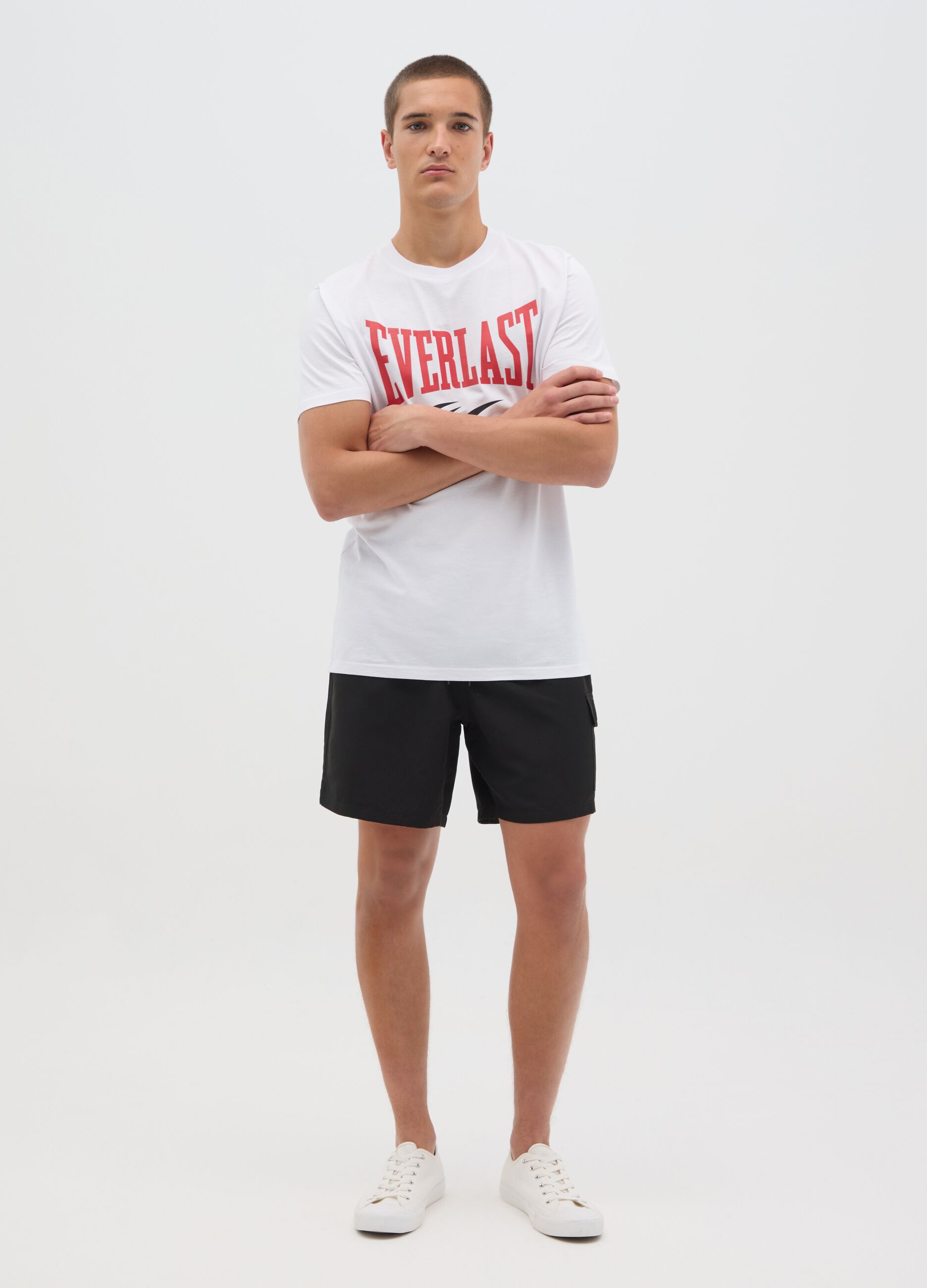 Black swimming trunks with logo print