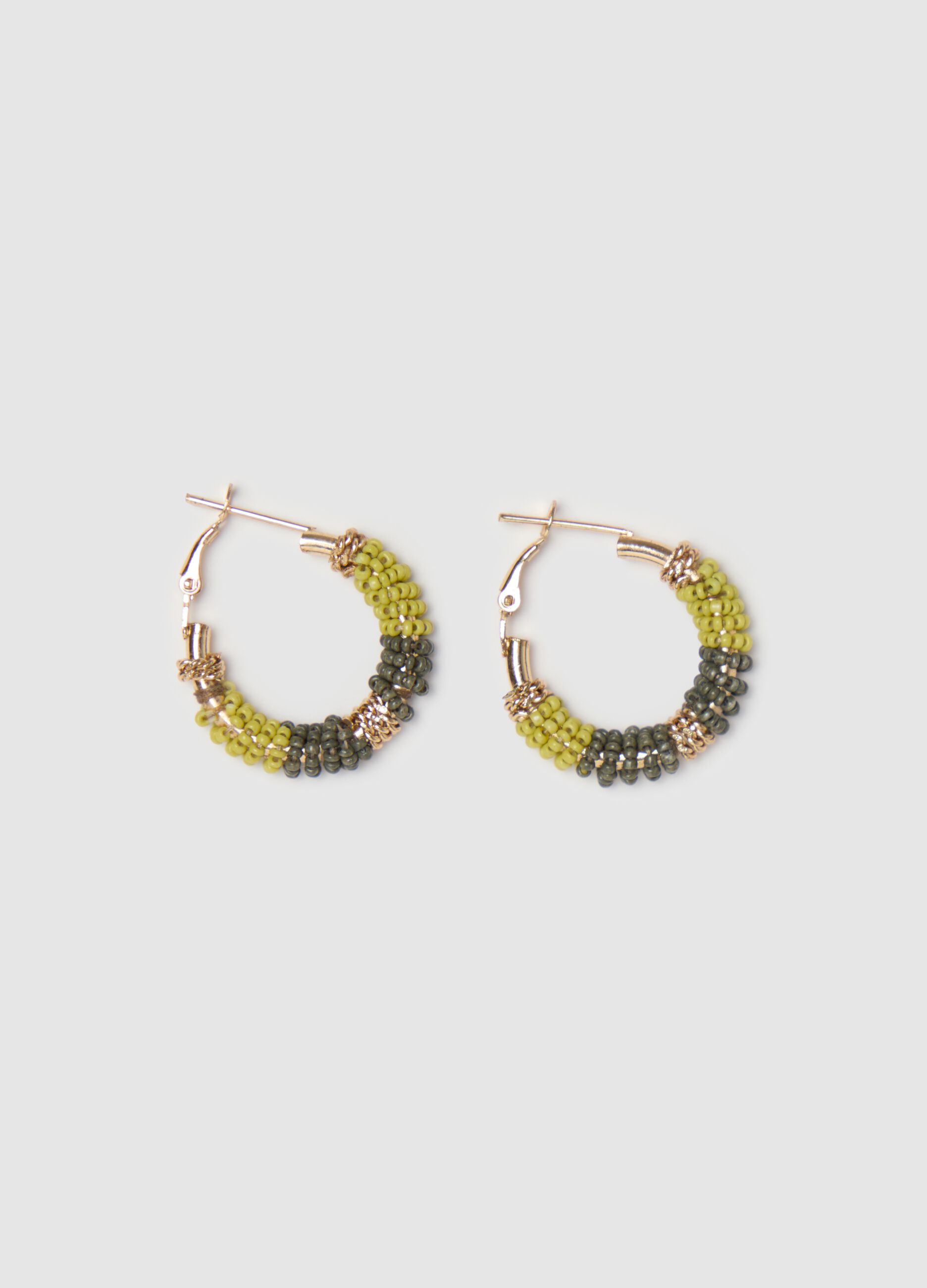 Hoop earrings with green and yellow beads