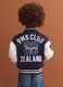 Blue varsity jacket with beige sleeves and print for boys_2