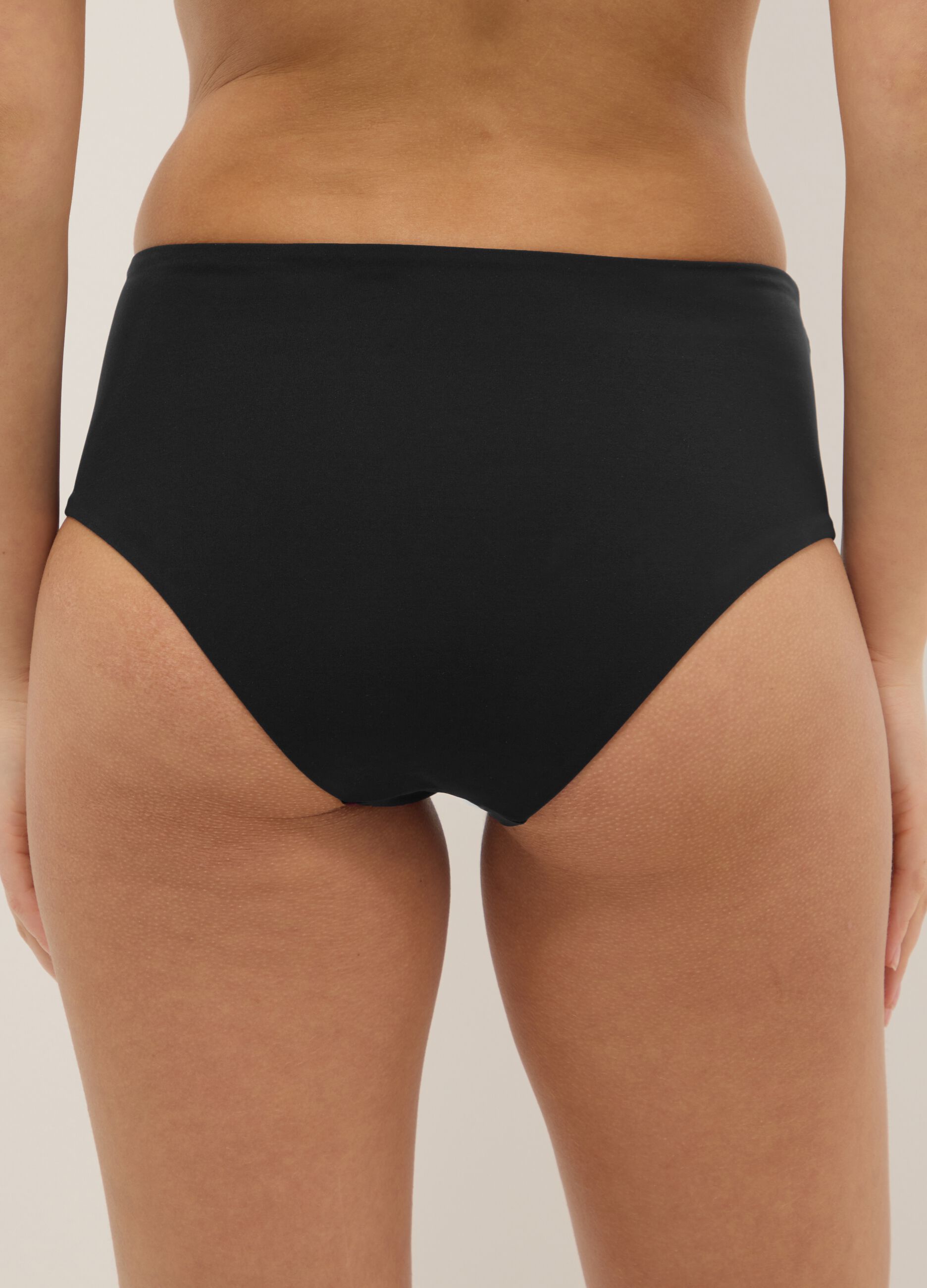 Black high-waisted stretch bikini bottoms with shaping effect