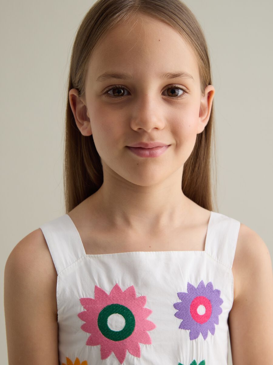 Sleeveless white dress with colourful floral prints PIOMBO Kids_3