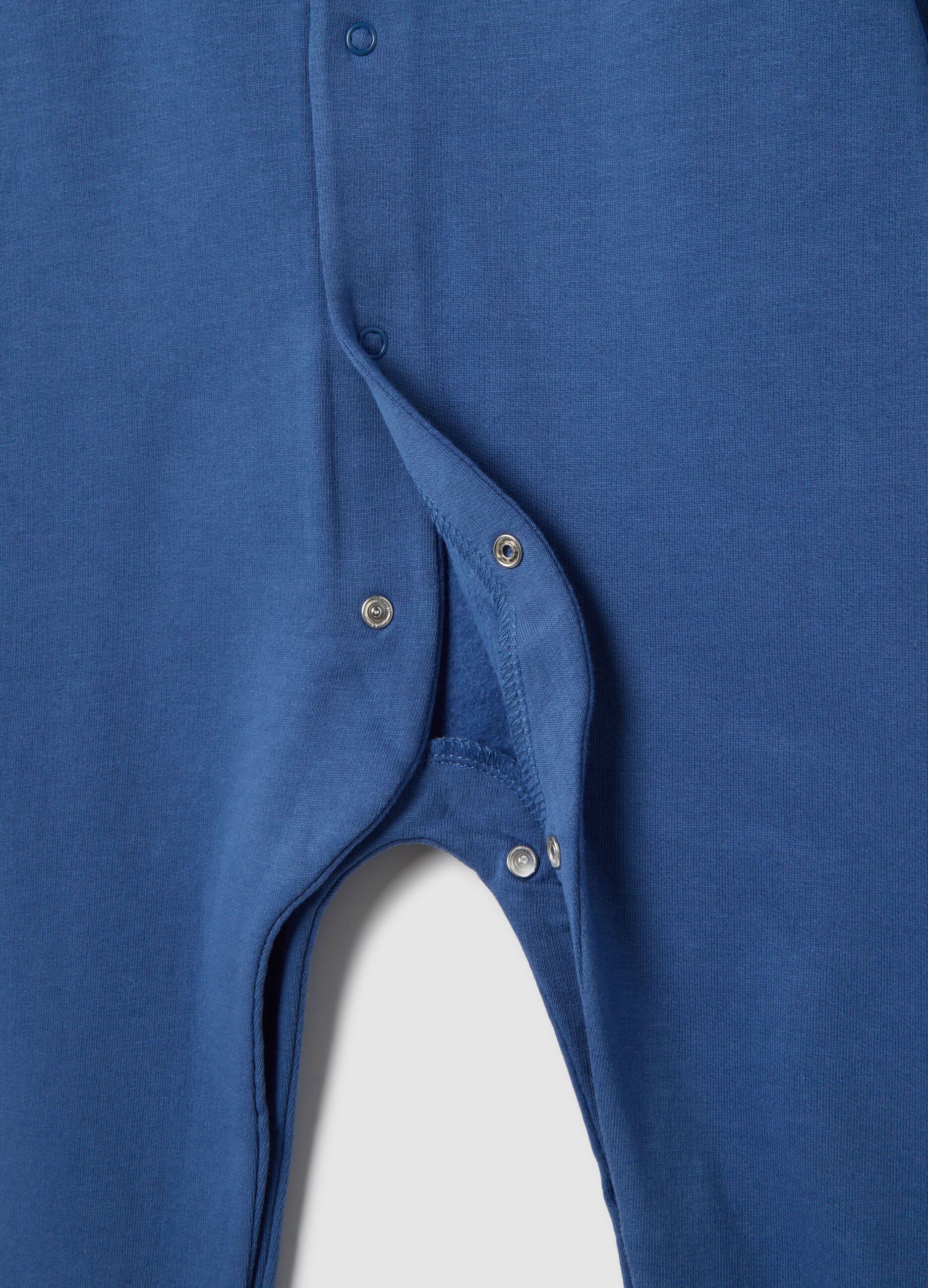 Blue cotton jumpsuit with dinosaur print