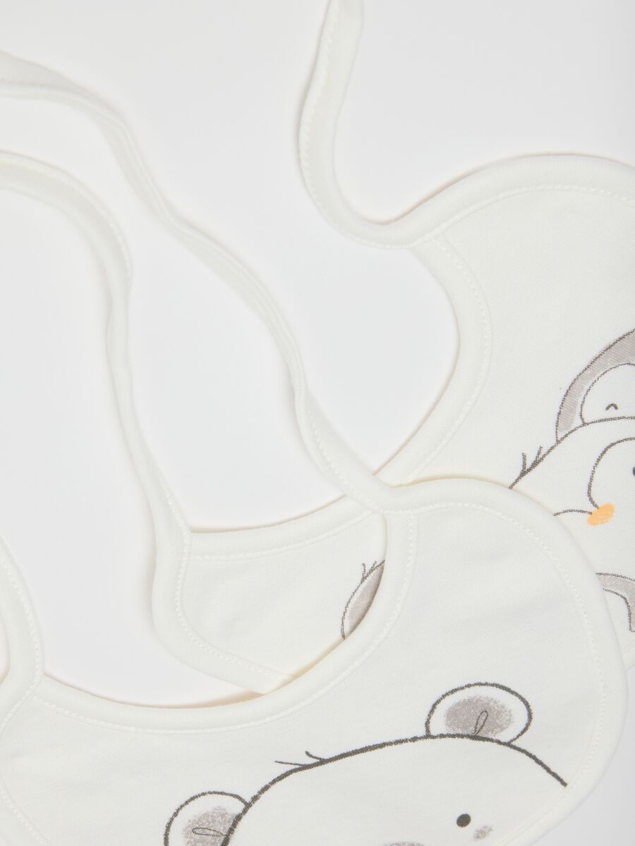Twin pack of white cotton bibs with animal prints_1