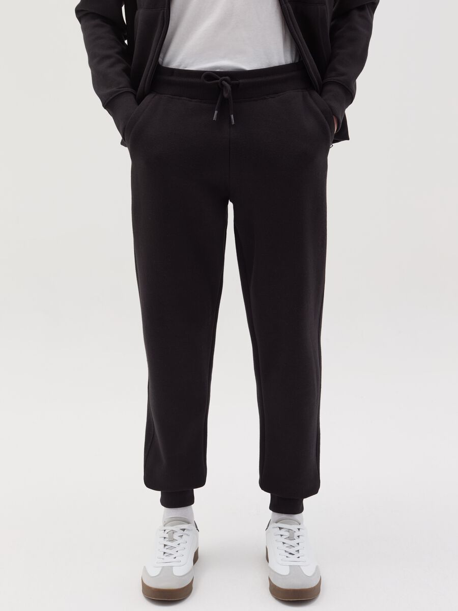 Fleece joggers with pockets and drawstring_1