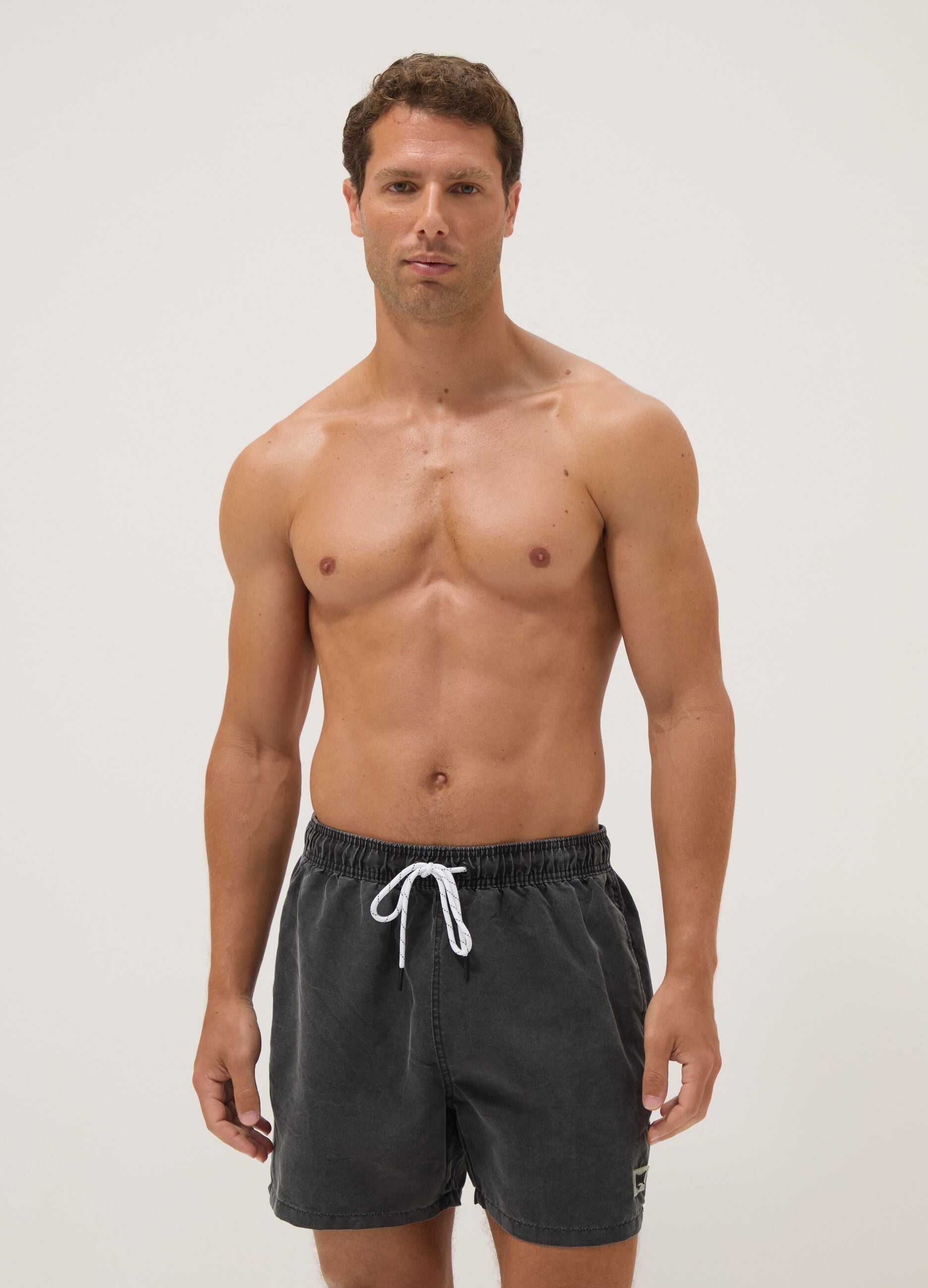 Black swim shorts with drawstring waist