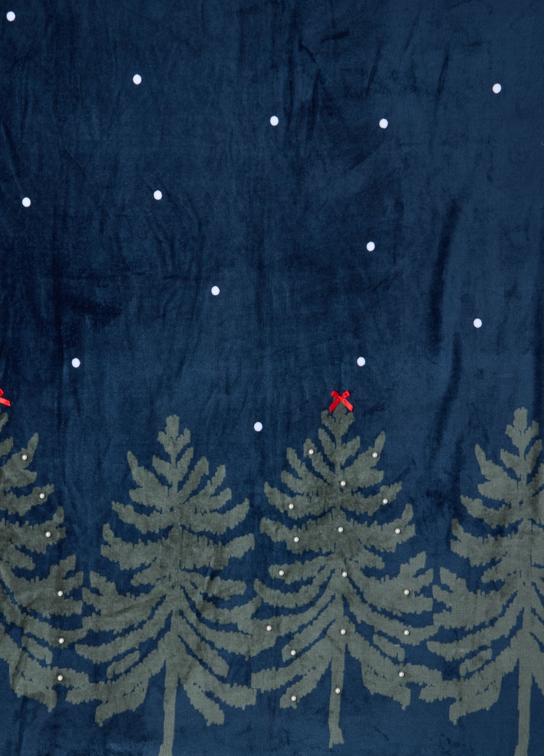 Blue and green throw with tree and polka-dot pattern