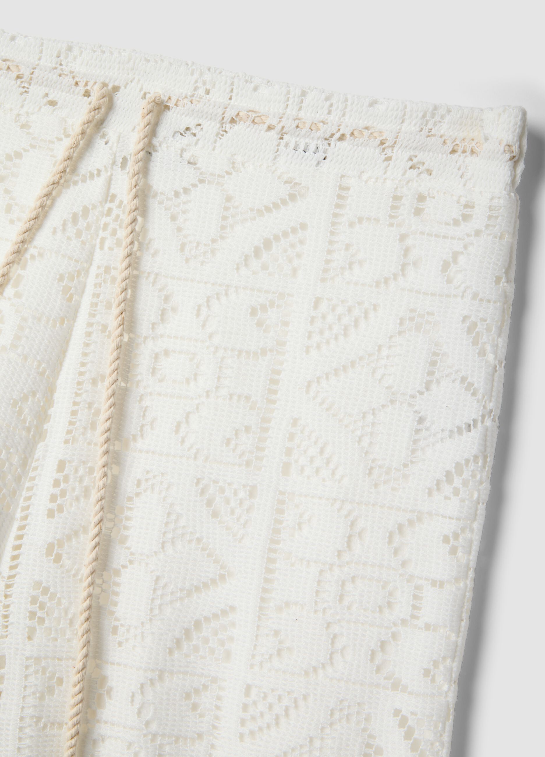 White openwork wide-leg trousers with elasticated waistband