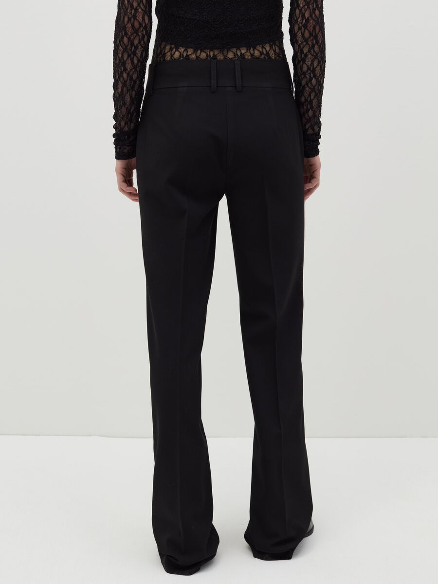 Flare-fit trousers with double button_2