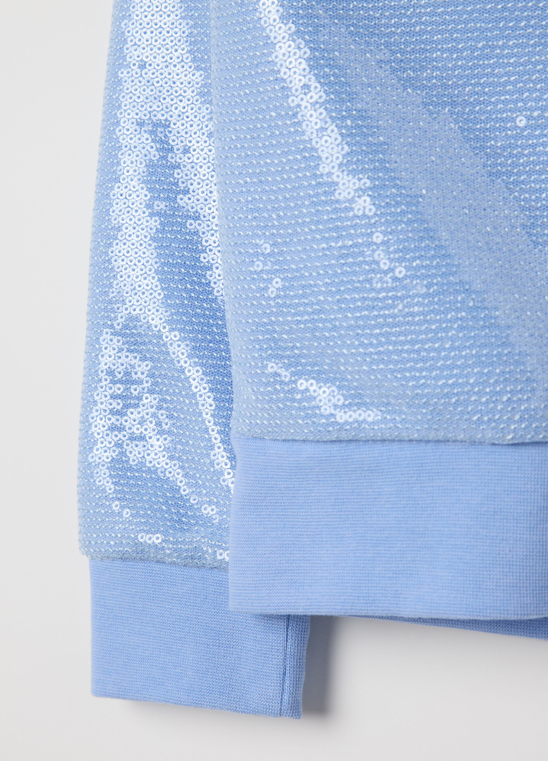 Light blue sweatshirt with sequins and zip