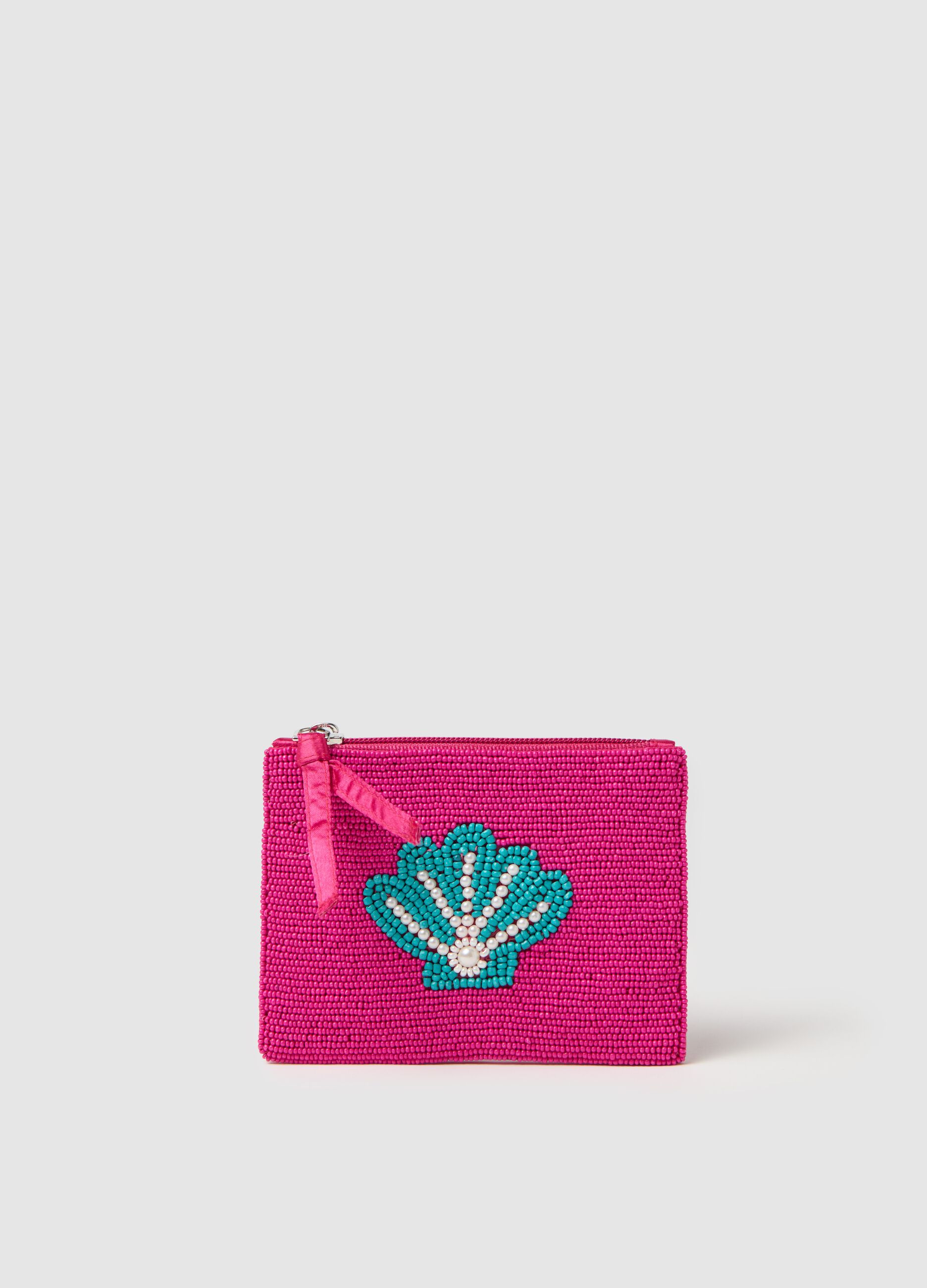 Pink glass purse with decoration