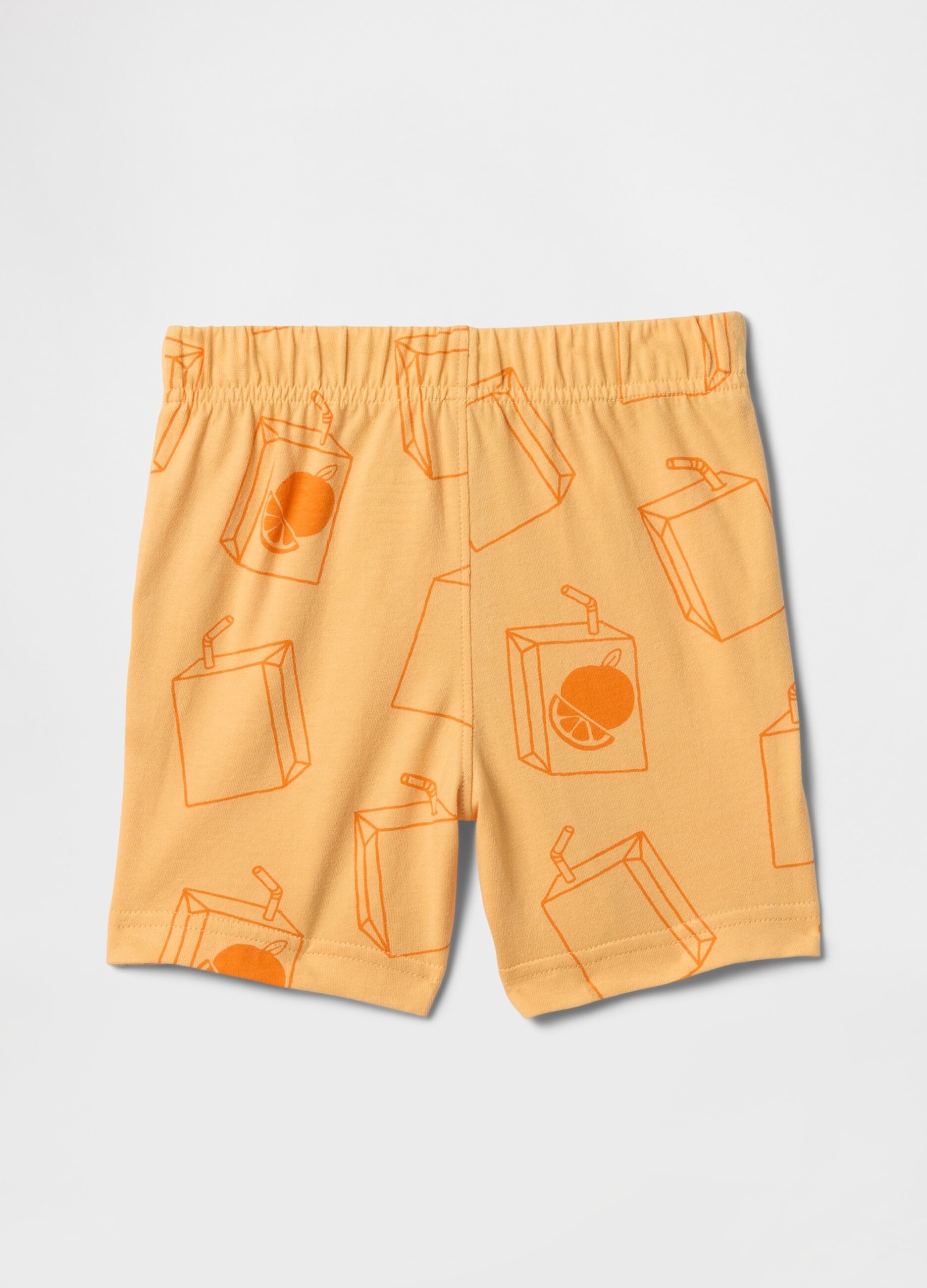 Orange shorts with fruit juice pattern