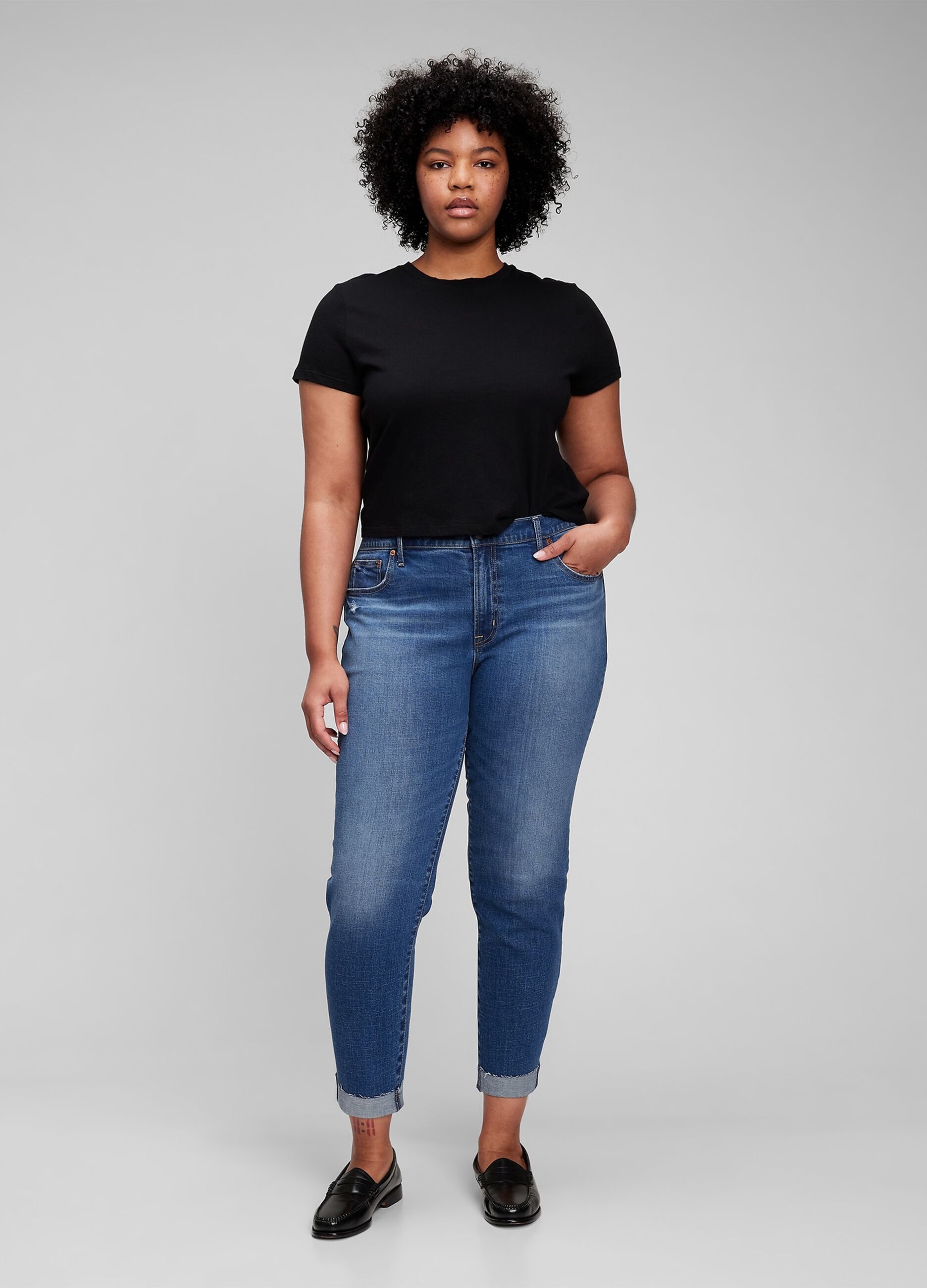 Girlfriend jeans with abrasions and raw edged hem