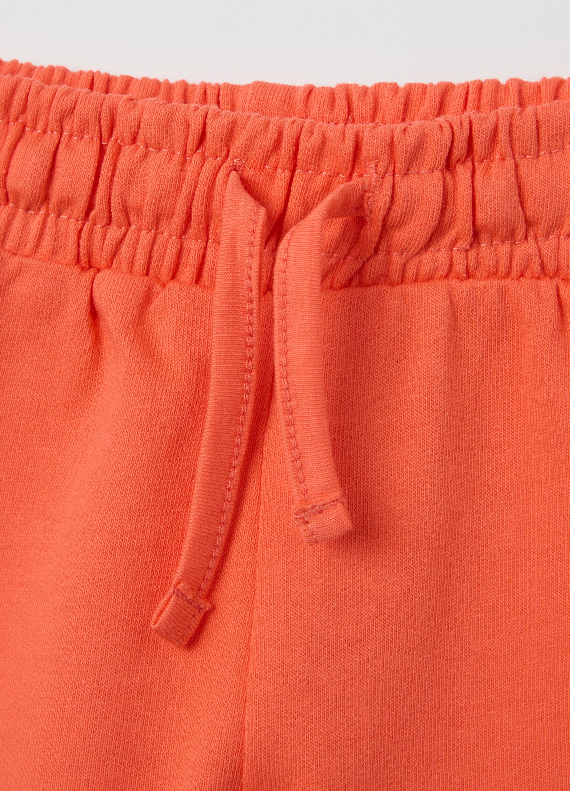 Orange shorts with cotton frills