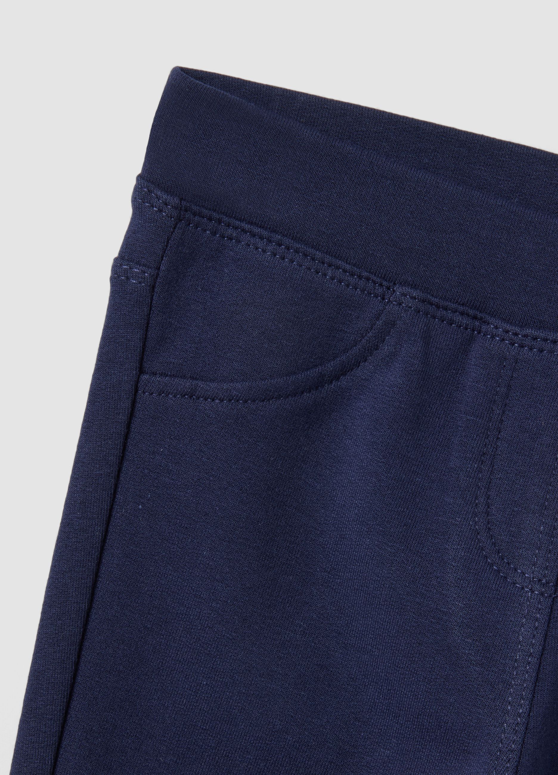 Pantaloni flare blu in cotone organico elasticizzato per bimba