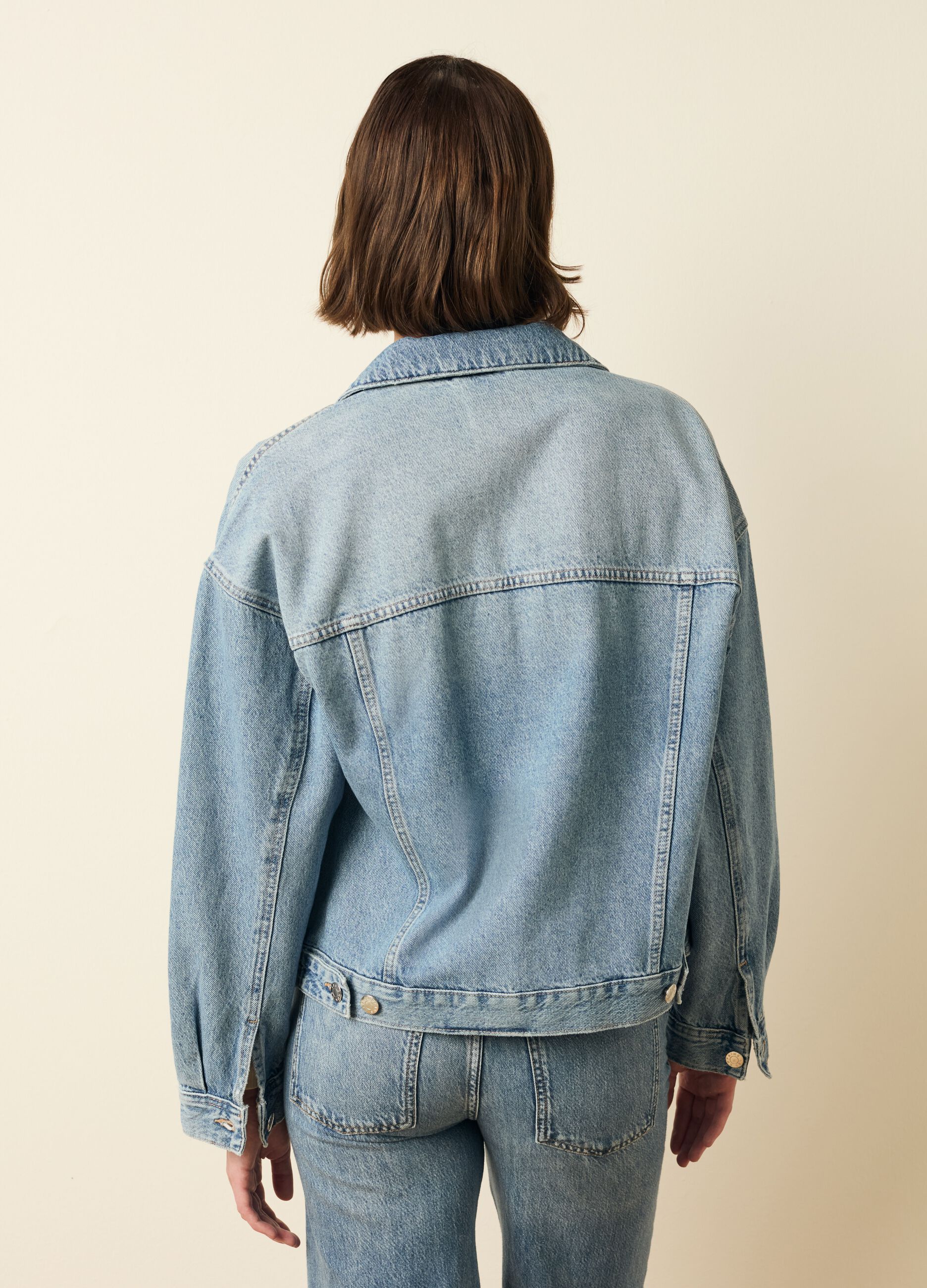 Giacca corta in denim acid wash