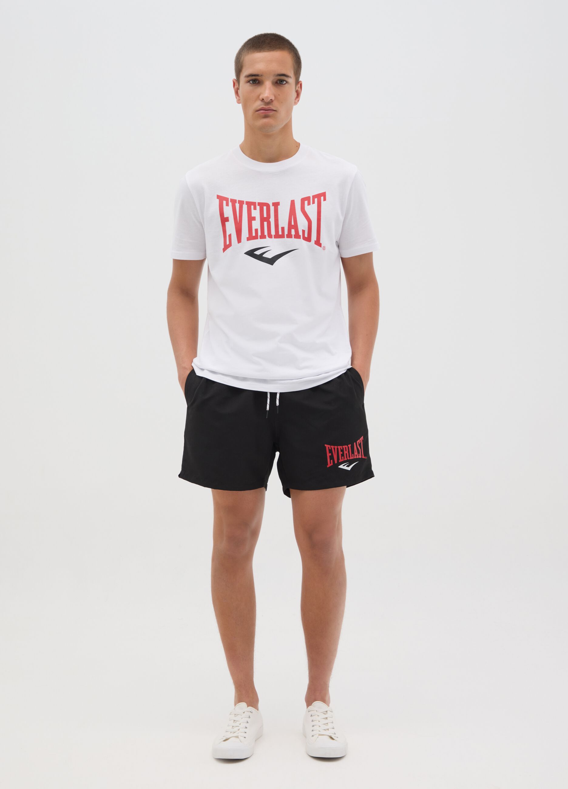 Black swimming trunks with logo print