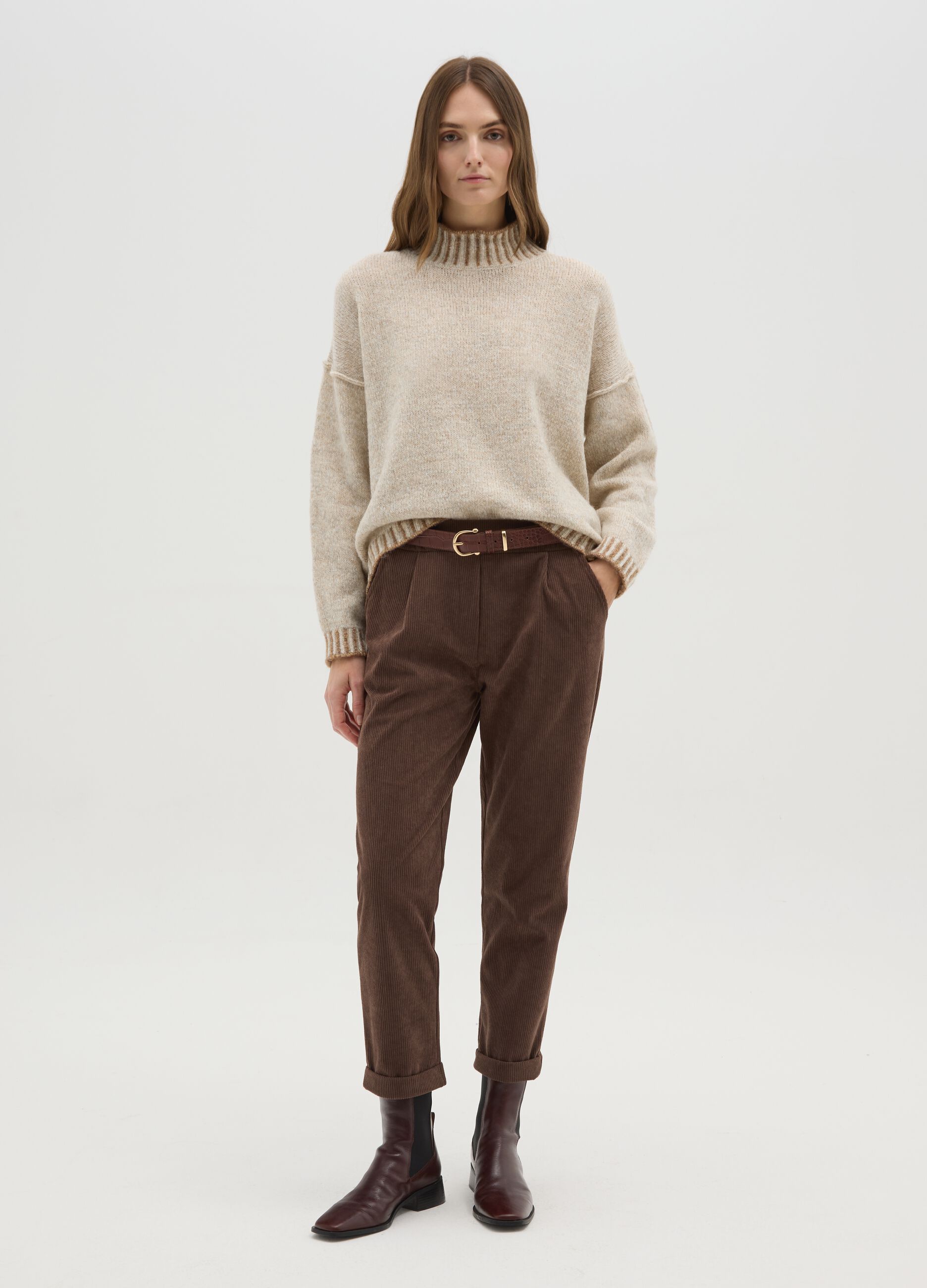 Beige sweater with high neck and contrasting edges